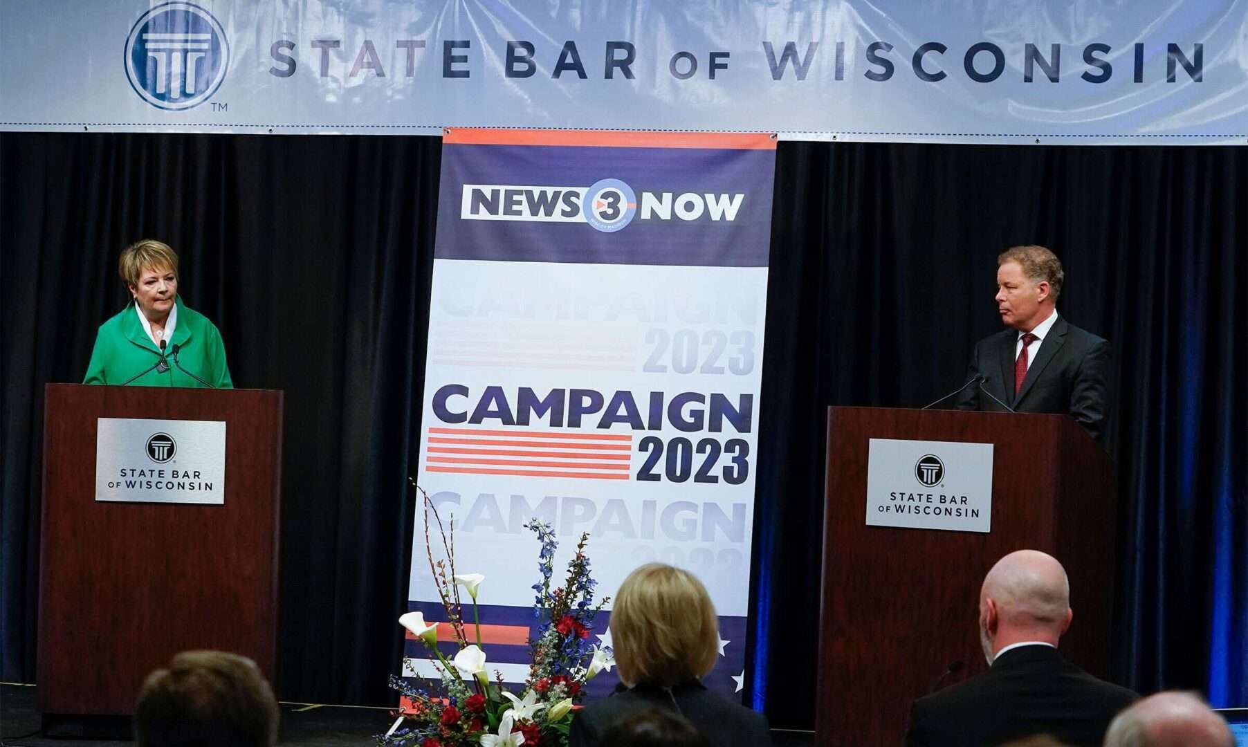 Wisconsin Supreme Court candidates Dan Kelly, who is backed by Republicans, and Janet Protasiewicz, who is backed by Democrats, participate in a March 21 debate in Madison, Wis.