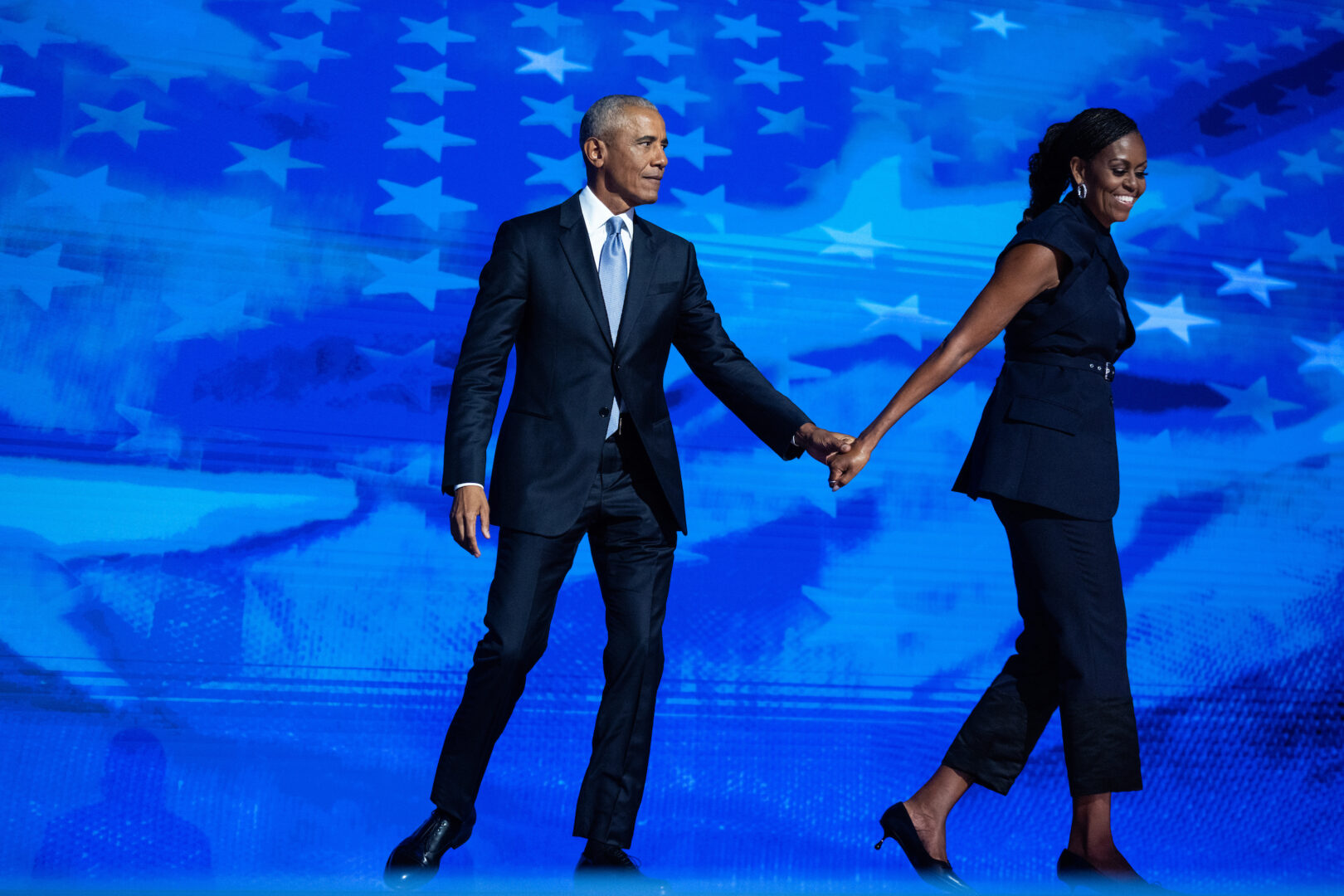 Former President Barack Obama and former first lady Michelle Obama appear onstage inside the United Center in Chicago on Tuesday, the second night of the Democratic National Convention.