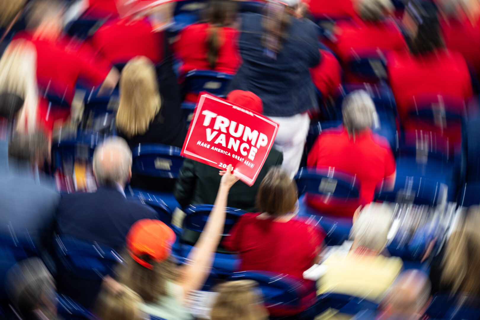 Delegates wave Trump-Vance signs on the floor at the Republican National Convention in Milwaukee on Tuesday.