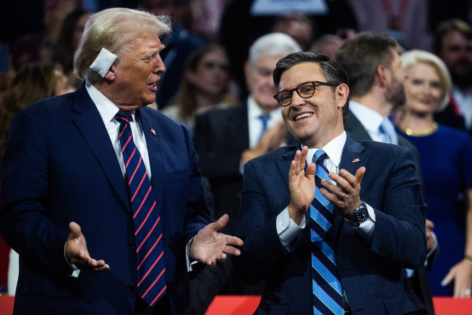 Former President Donald Trump, the Republican presidential nominee, talks with Speaker Mike Johnson, R-La., on the third night of the Republican National Convention in Milwaukee on July 17. 