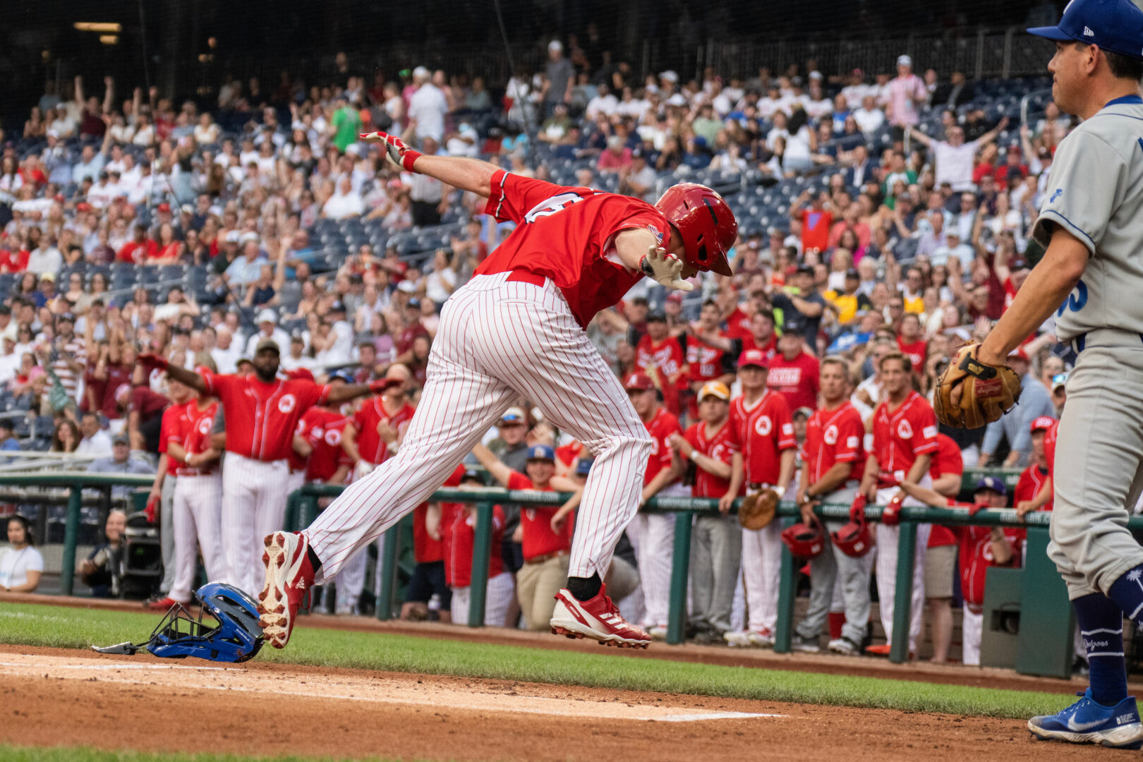 Rep. Jake Ellzey, R-Texas, scores in the first inning during the Congressional Baseball Game at Nationals Park on Wednesday night.