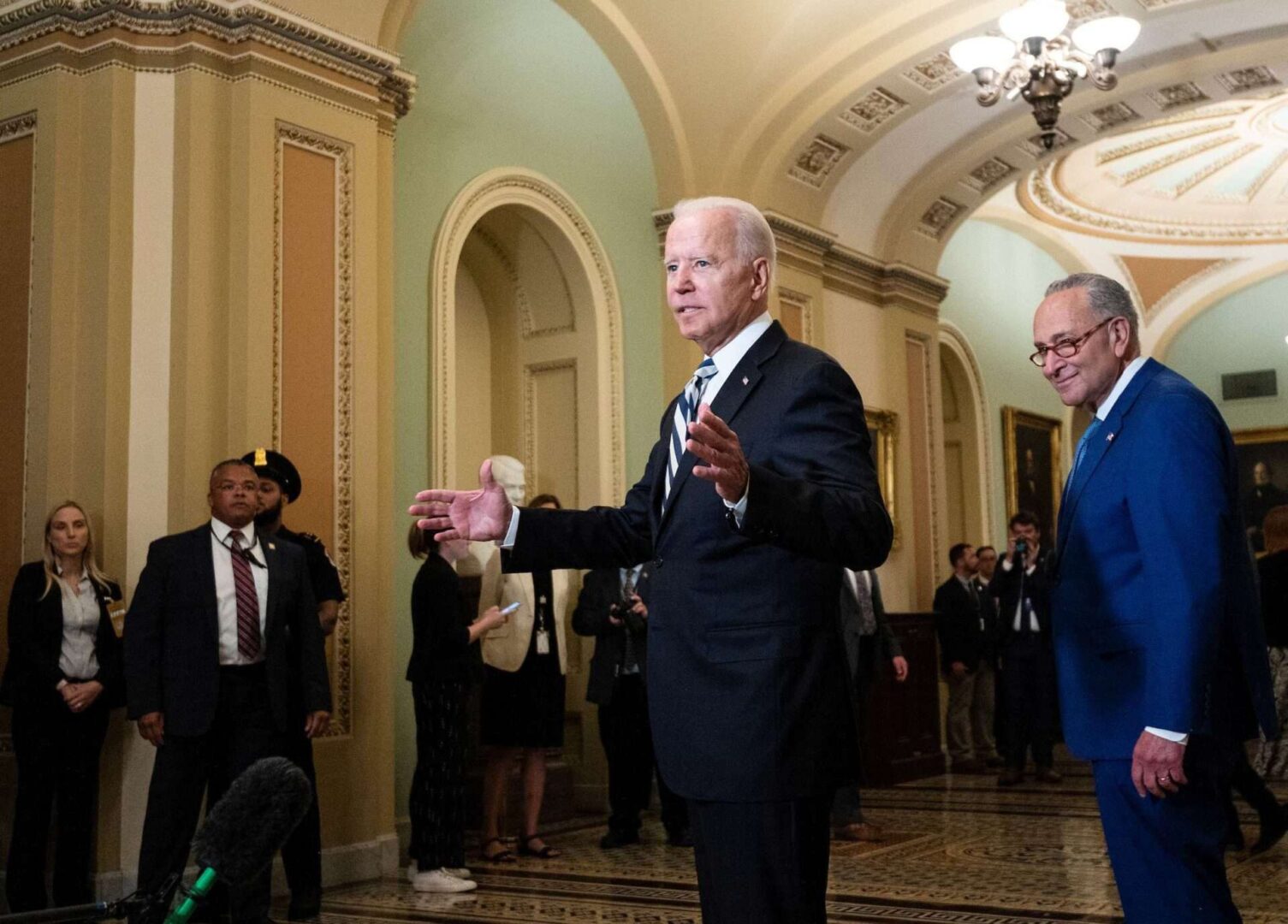 President Joe Biden and Senate Majority Leader Charles E. Schumer are seen in the Capitol in July. Democrats are struggling to unify their party around Biden’s agenda, Rothenberg writes.