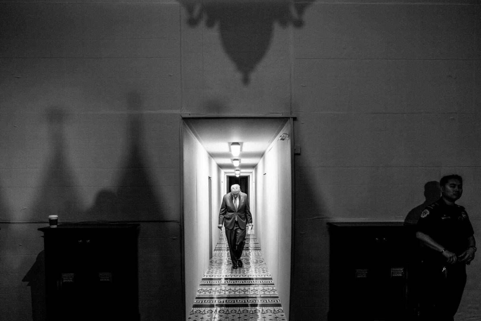 Senate Majority Leader Charles E. Schumer walks through a temporary walkway in the Capitol on May 24, 2022, as the Ohio Clock Corridor undergoes renovations.