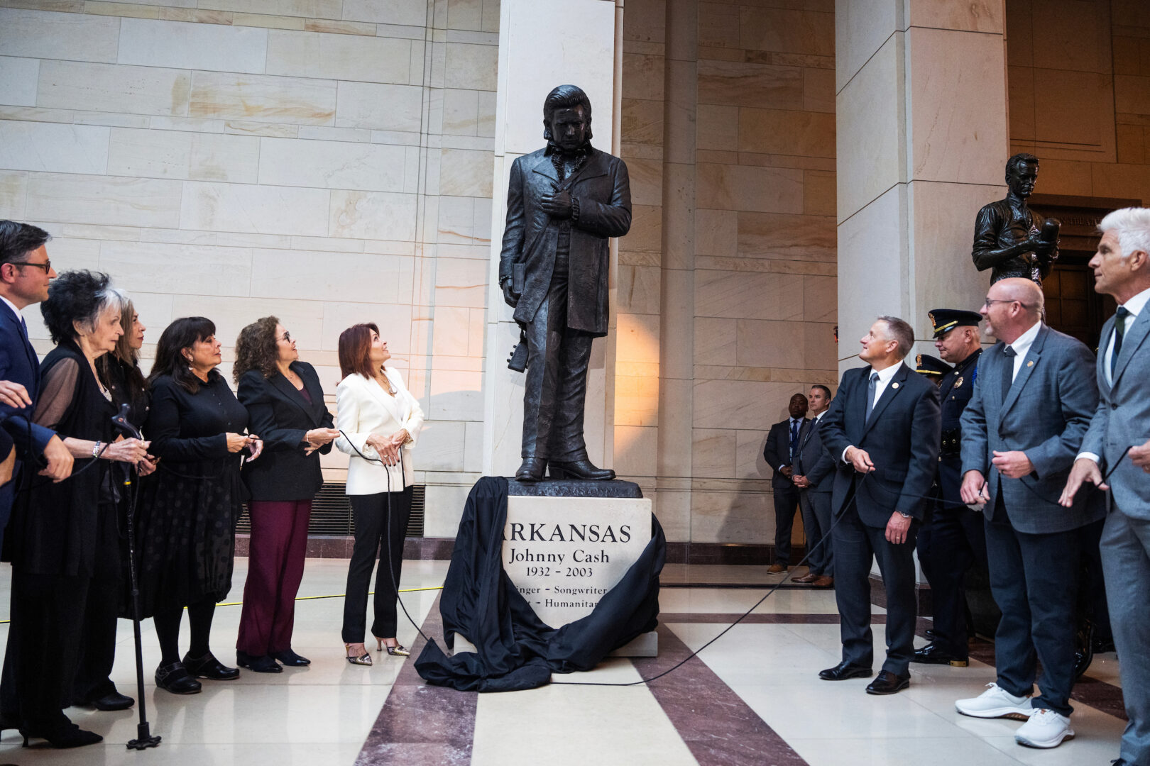 A statue of country music legend Johnny Cash is unveiled during a ceremony in Emancipation Hall on Tuesday.