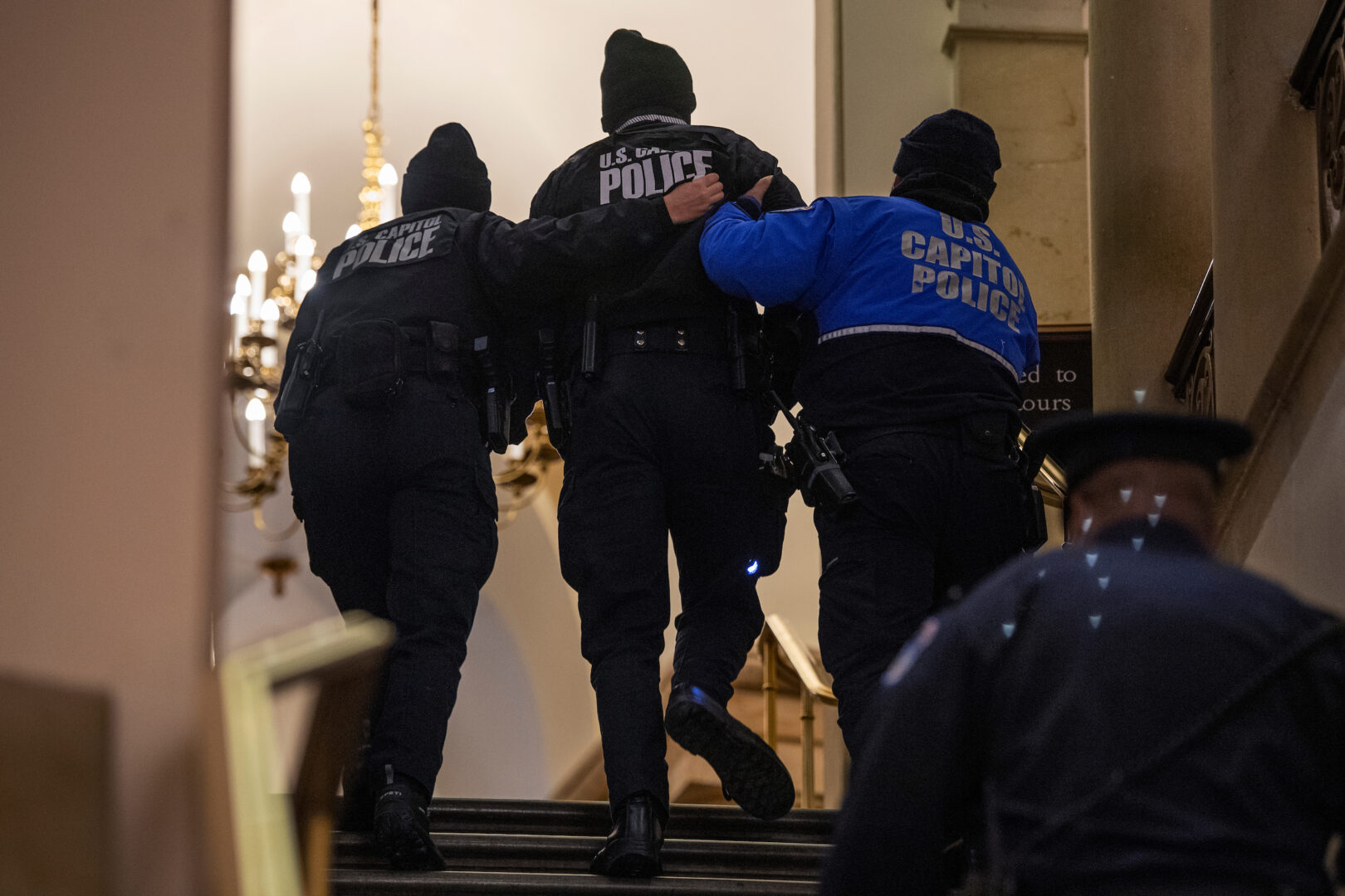 A Capitol Police officer receives medical treatment after clashes with rioters on Jan. 6, 2021. A plaque to honor responding officers is finished, Democrats have said, but still waiting to be installed. 