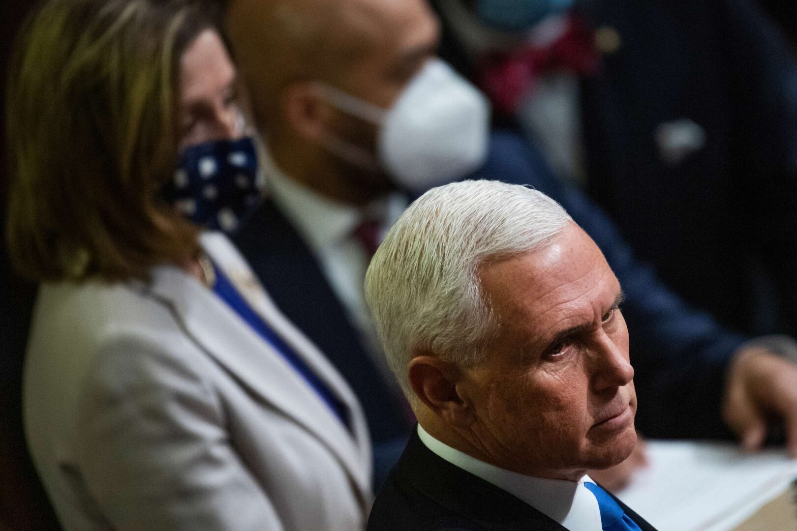 Vice President Mike Pence is seen here with Speaker Nancy Pelosi during the joint session of Congress to certify the Electoral College votes on Jan. 7, 2021. Rioters had stormed the Capitol the day before.