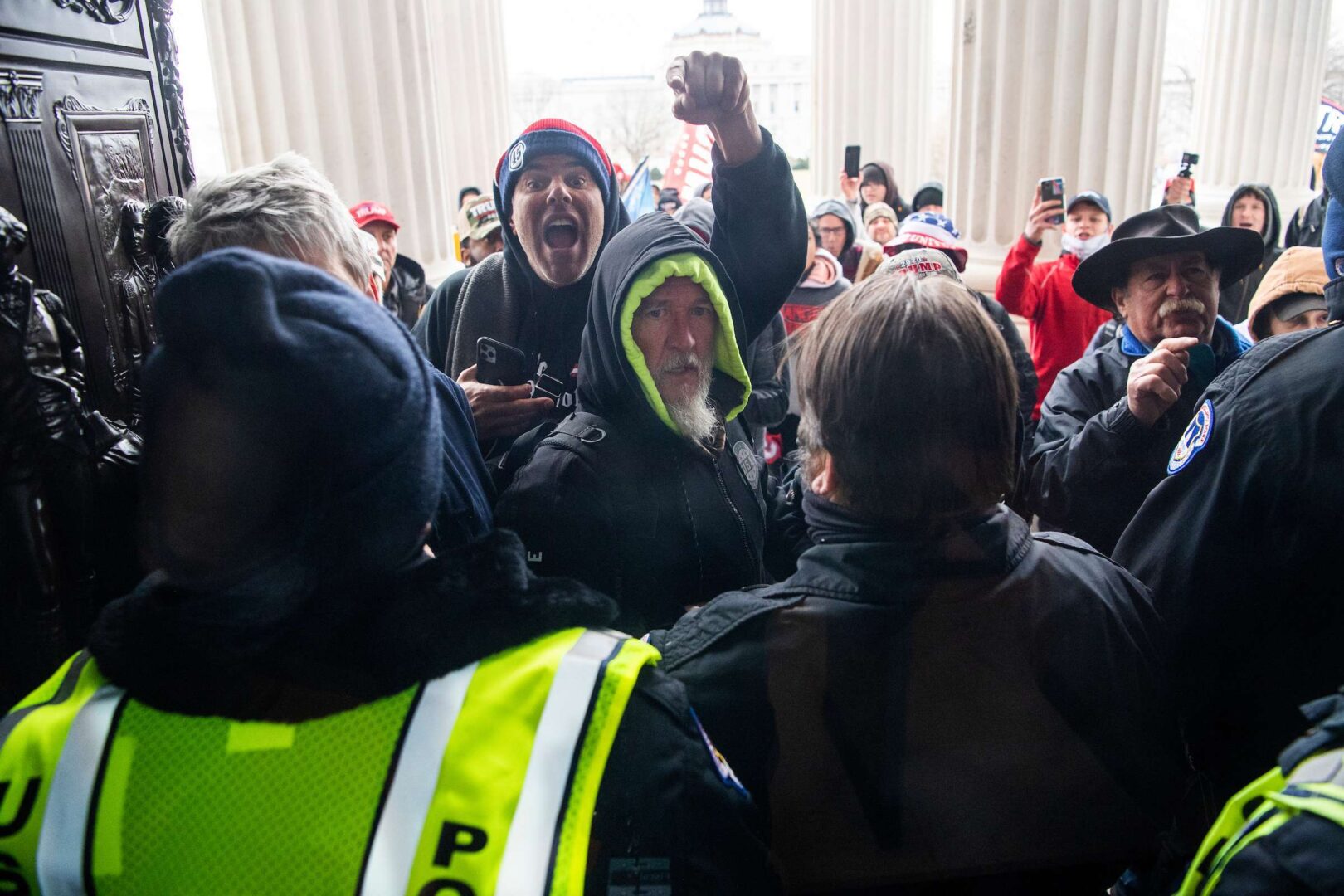 Pro-Trump rioters breach the Capitol on Jan. 6. The former president is a polarizing figure and attitudes toward him have reshaped modern voting patterns, Rothenberg writes. 