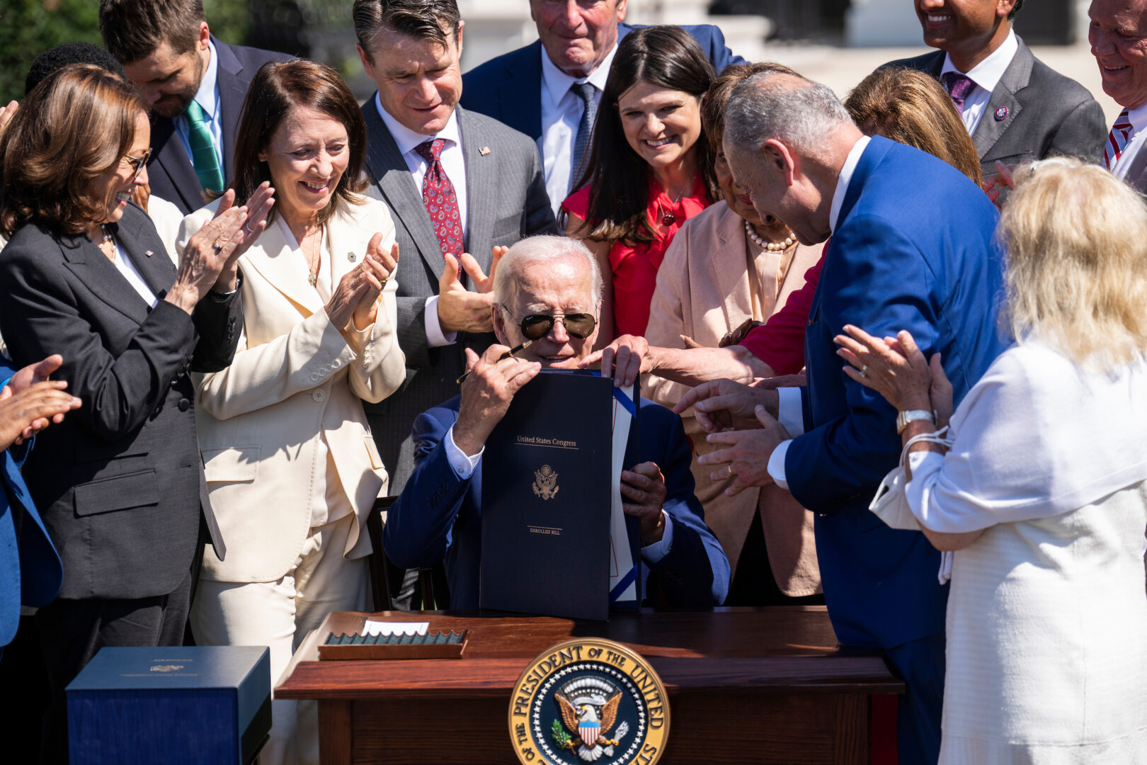 President Joe Biden signs the CHIPS and Science Act of 2022 on the South Lawn of the White House. 