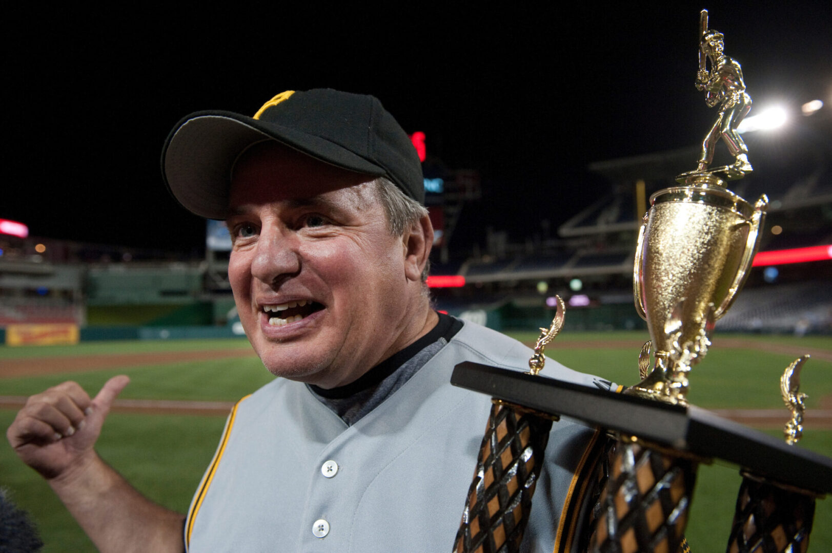 Rep. Mike Doyle, D-Pa., holds the Roll Call Trophy at Nationals Park on July 14, 2011 after Democrats won the 50th Annual Congressional Baseball Game.