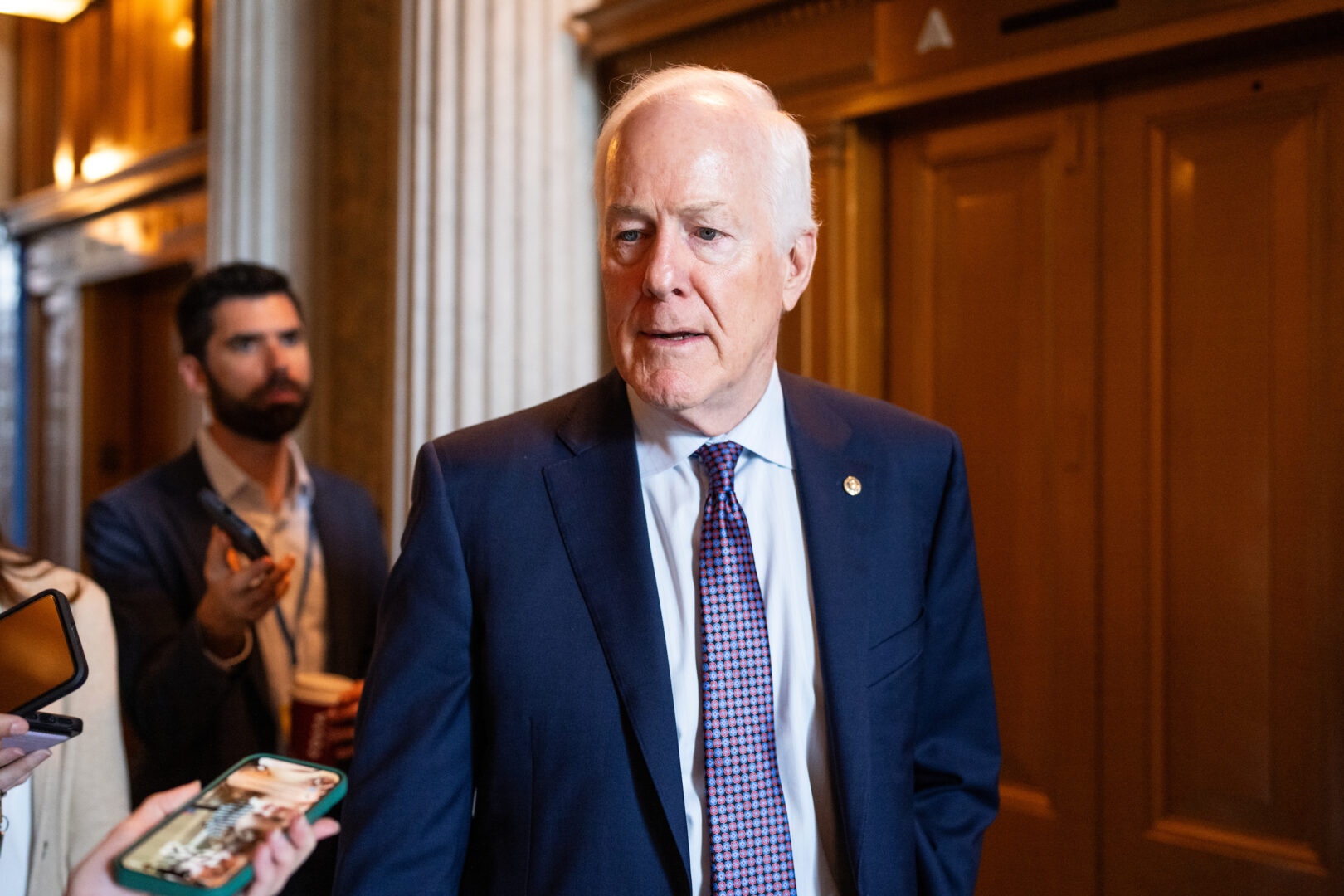 Texas Republican Sen. John Cornyn speaks to a reporter in the Capitol on June 4.