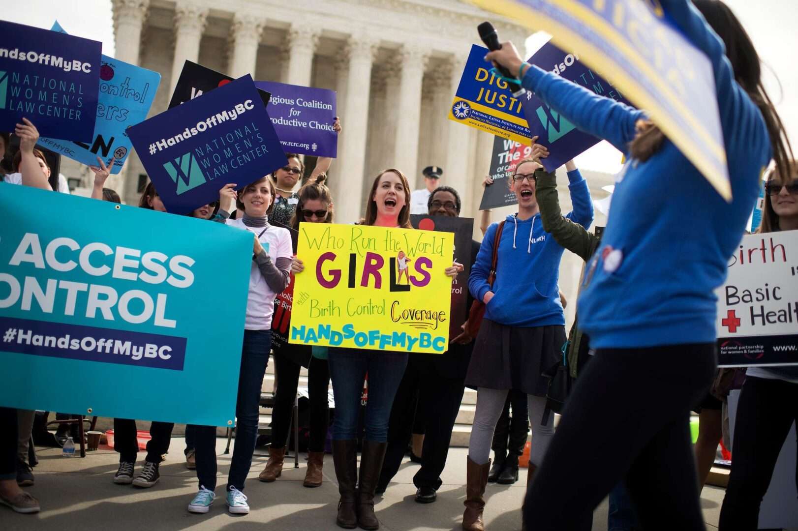 Demonstrators appear outside the Supreme Court on March 23, 2016, as religious organizations were challenging the 2010 health insurance law's provision requiring employer health plans to cover birth control. 