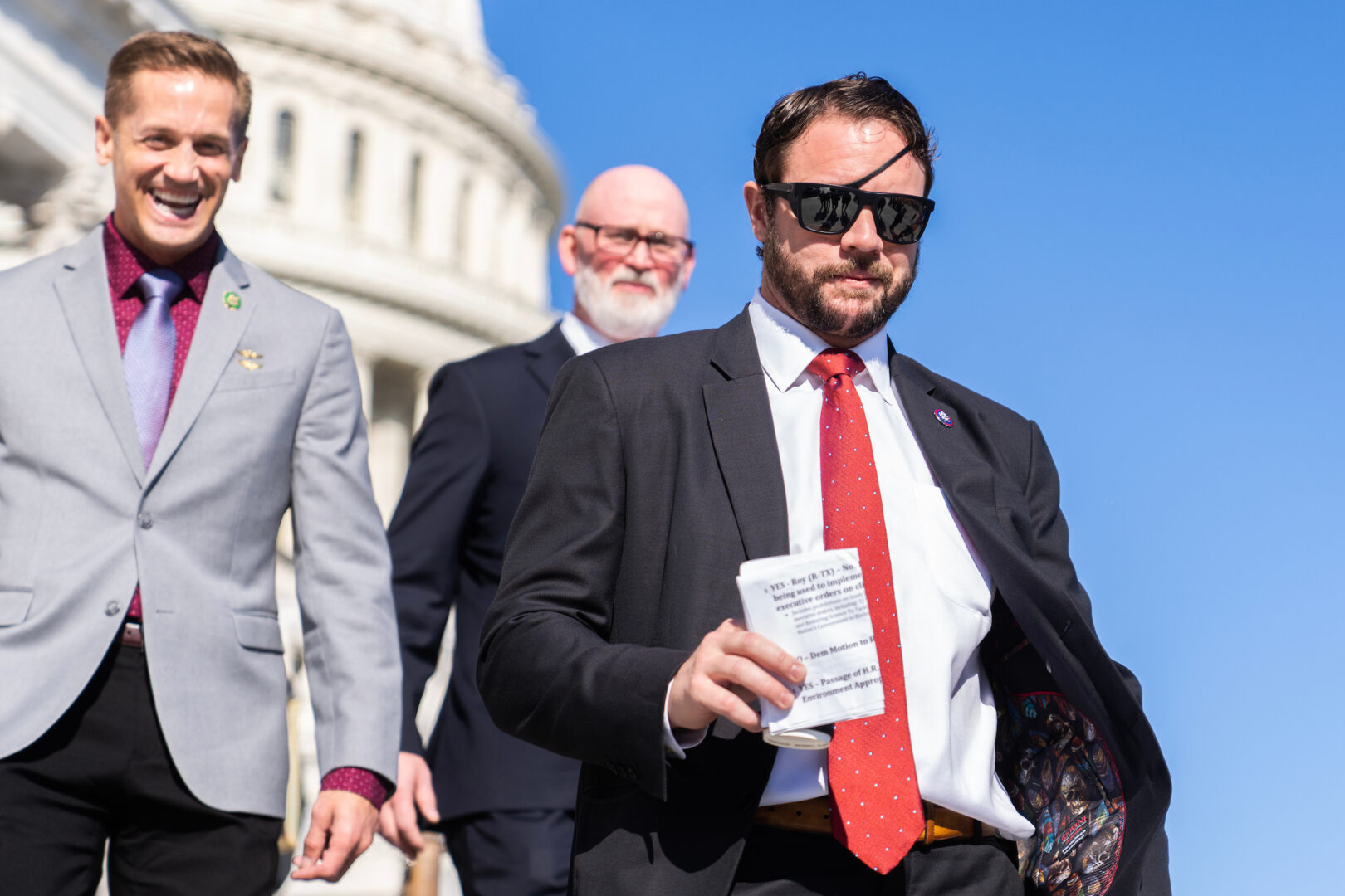 Reps. Dan Crenshaw, R-Texas, right, Rich McCormick, R-Ga., left, and Derrick Van Orden, R-Wis., leave the U.S. Capitol after the last votes of the week on Friday, Nov. 3, 2023.  Crenshaw introduced a bill that would bar  federal funds aimed at training pediatricians from going to hospitals that provide gender-affirming care. "This is the issue of our time. This is the hill we're going to die on," he said of the issue.