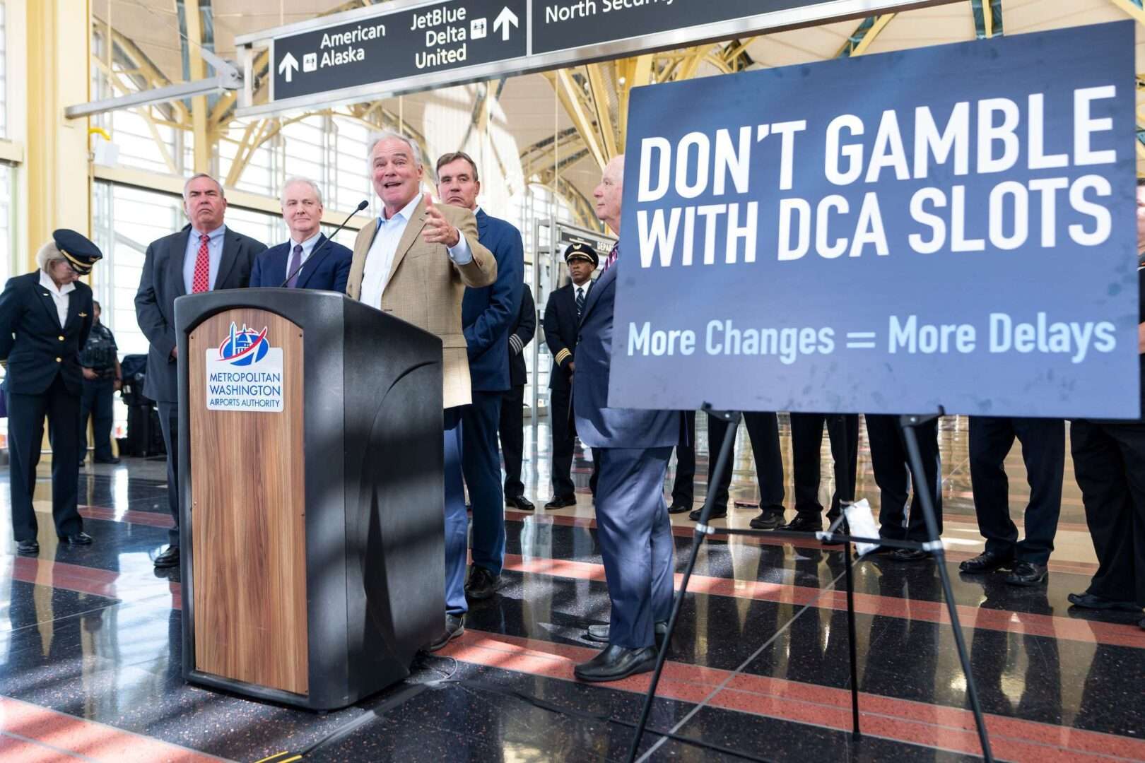 From left, Jack Potter, president and CEO of the Metropolitan Washington Airports Authority, Sen. Chris Van Hollen, D-Md., Sen. Tim Kaine, D-Va.,  Sen. Mark Warner, D-Va., and Sen. Ben Cardin, D-Md., told reporters Monday they oppose changes to Reagan National Airport’s slot and perimeter rules. 