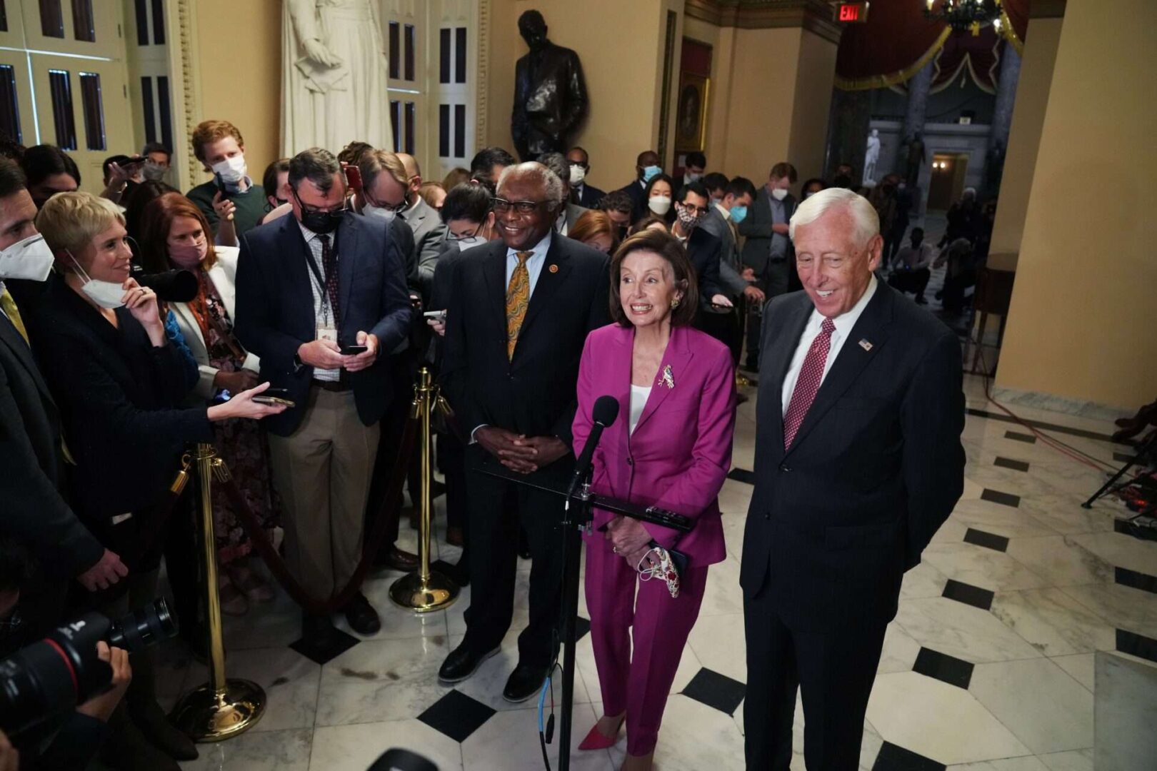 Speaker Nancy Pelosi, D-Calif., Majority Leader Steny Hoyer, D-Md., right, and Majority Whip Jim Clyburn, D-S.C., talk about the infrastructure bill before the House voted Friday.