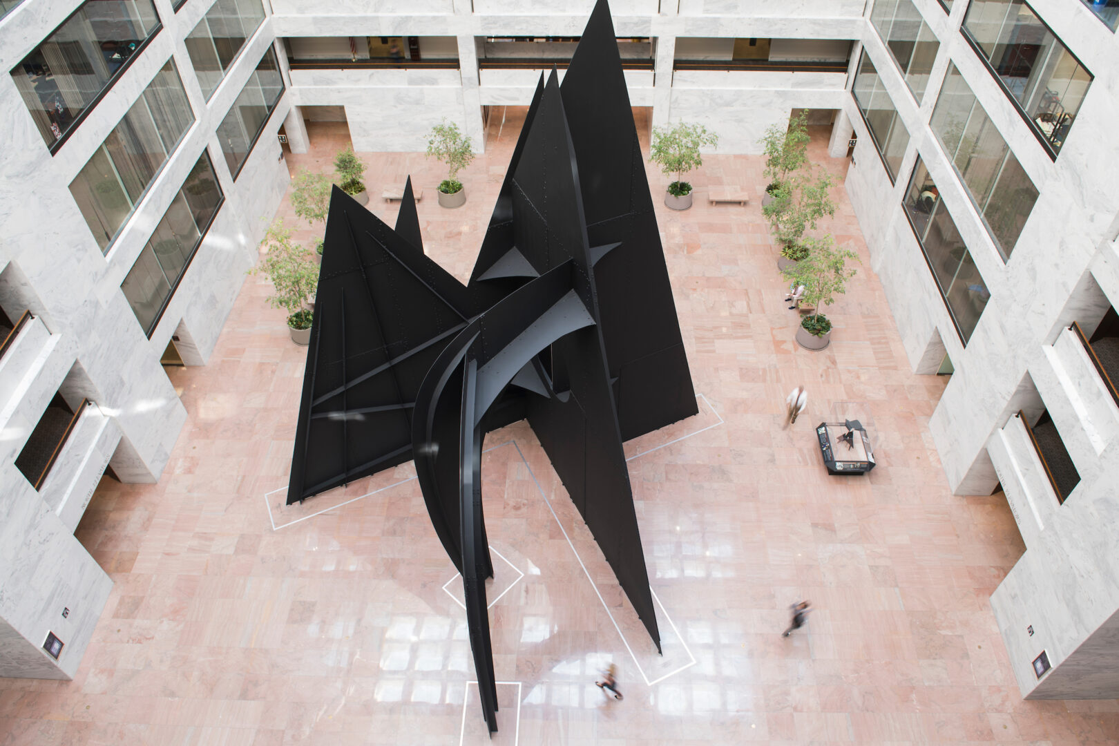 The “Mountains and Clouds” sculpture, seen here in 2019, stands tall in the atrium of the Hart Senate Office Building. But the “clouds” part is still in limbo.