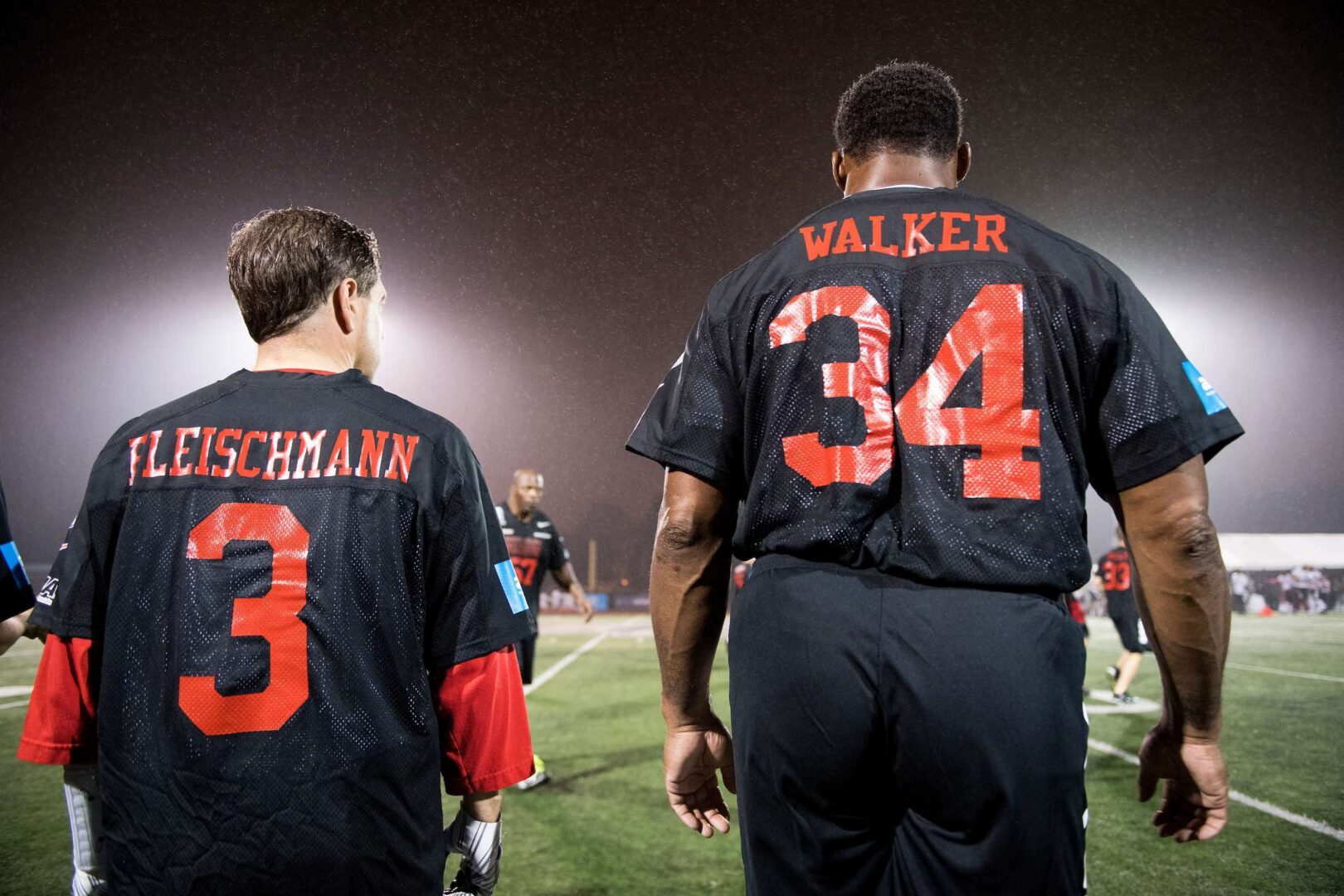 Rep. Chuck Fleischmann, R-Tenn., and Herschel Walker watch from the sidelines during the Congressional Football Game at Gallaudet University in Washington in 2017. Walker is running for Senate in Georgia. 