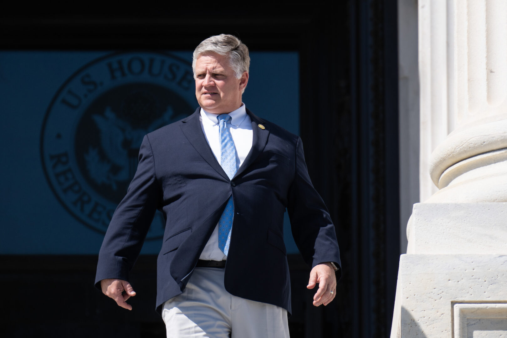 Rep. Drew Ferguson, R-Ga., walks down the House steps after the last vote on March 30. 