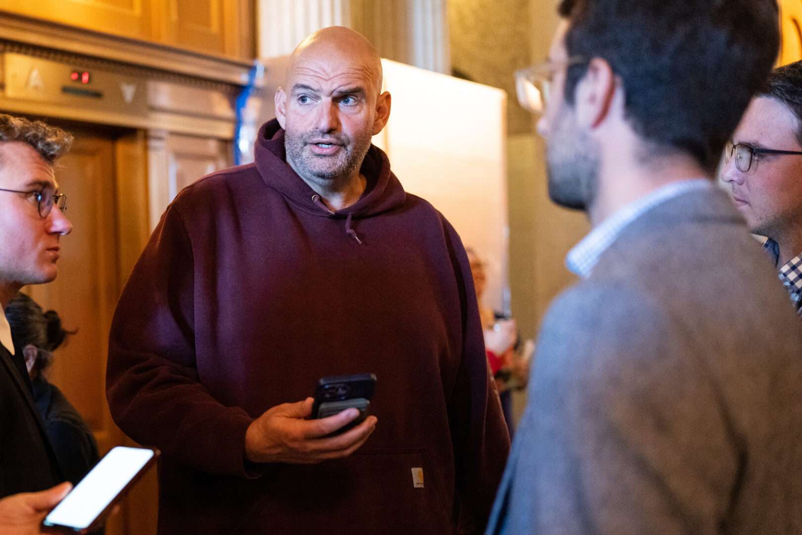 Sen. John Fetterman, D-Pa., speaks with reporters after the Senate Democrats’ weekly lunch in the Capitol on Wednesday.