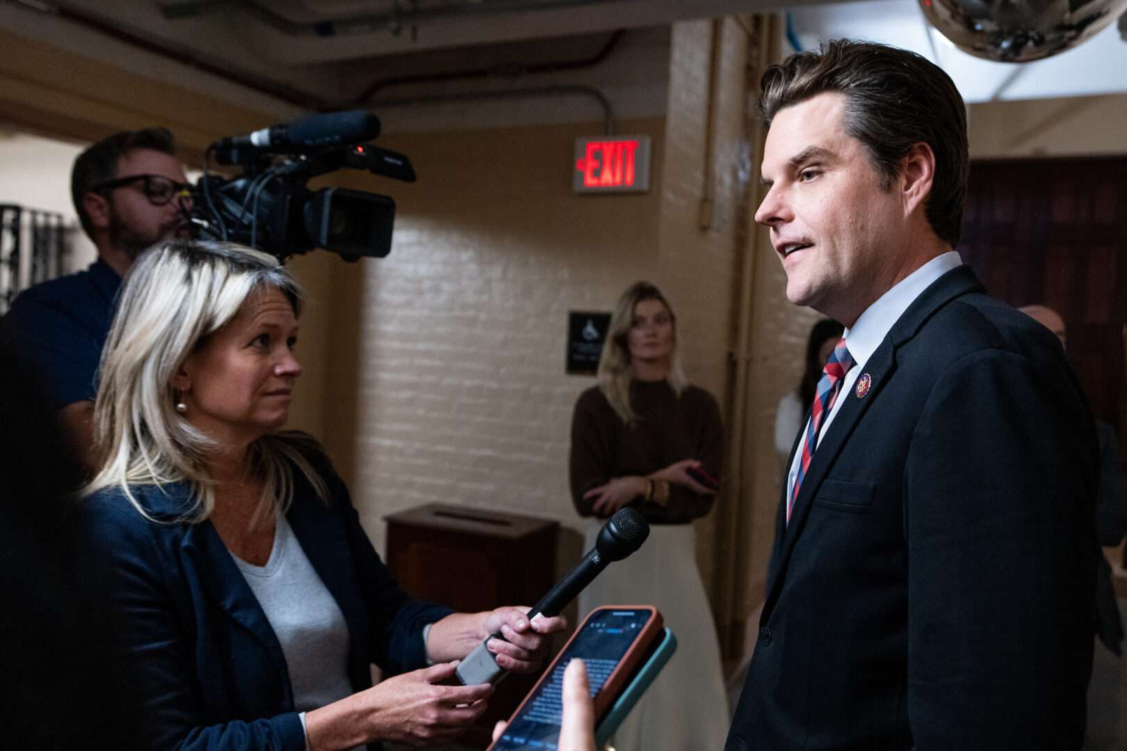 Rep. Matt Gaetz, R-Fla., stops to speak as he leaves the House Republican conference meeting in the Capitol on Monday.