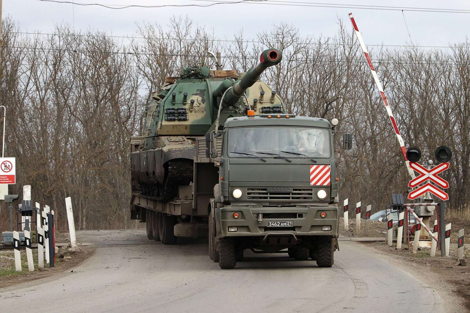 A Russian military transport truck carries a self-propelled howitzer past the village of Pokrovskoye in Russia. Russia on Monday recognized the Donetsk and Luhansk regions of Ukraine as independent.