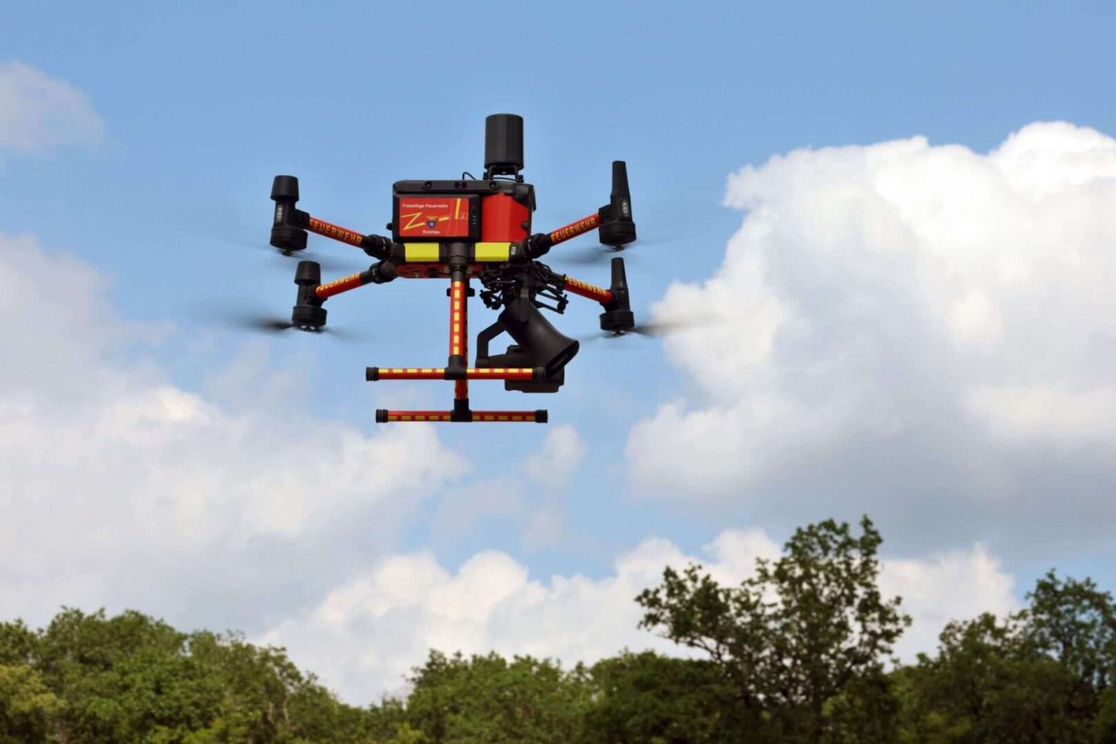 A fire department drone equipped with a thermal imaging camera and loudspeaker flies over a German training area during a fire drill on June 24. 