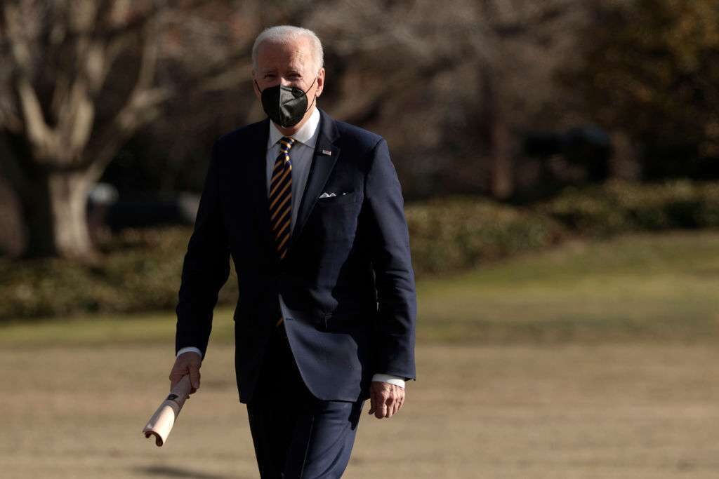 Biden walks across the South Lawn after returning to the White House on Marine One on Thursday.