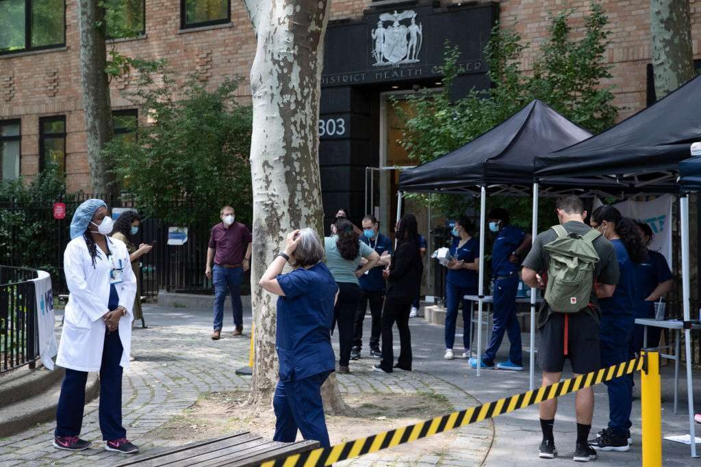 People consult about monkeypox vaccination at a temporary clinic on June 24 in New York City.