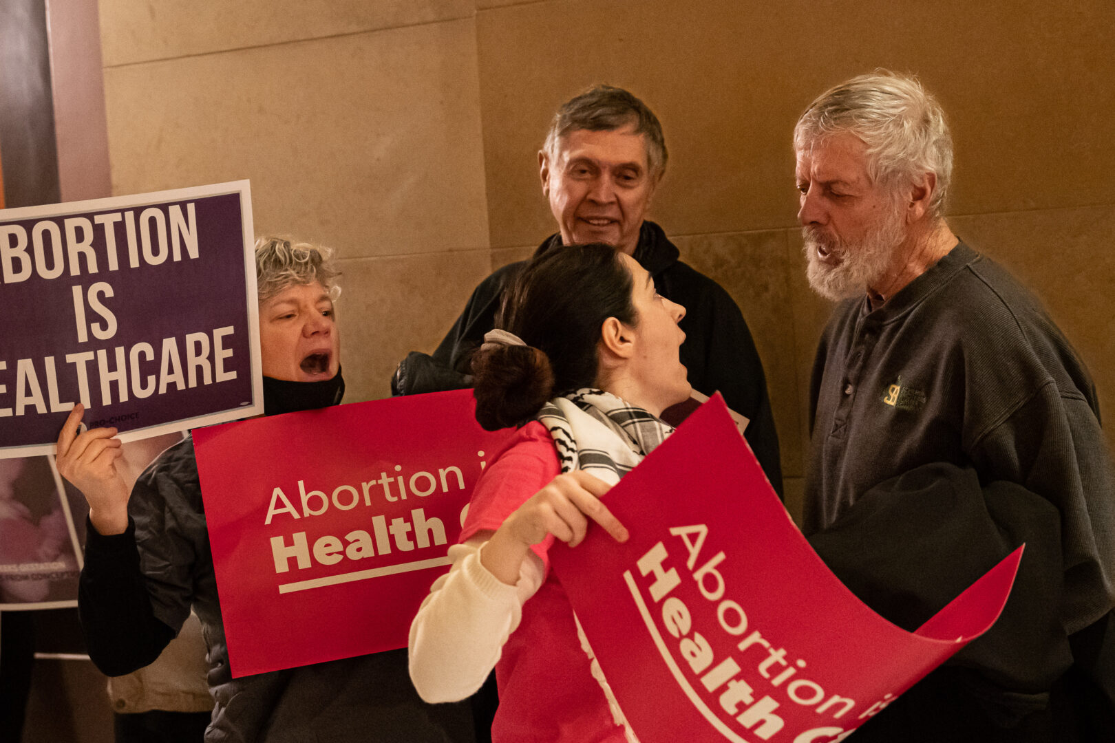 Abortion protesters faced off outside the Minnesota Legislature's House Chamber in the State Capitol building, Thursday, Jan. 19, 2023, in St. Paul, Minn., during the first day an abortion bill was being heard in the House. The Democratic Legislative Campaign Committee, which focuses on electing Democratic majorities to state legislatures, has identified abortion as a key electoral issue going into the 2024 election cycle.