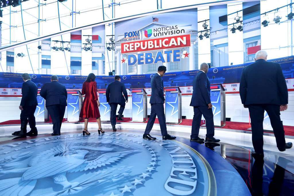 Republican presidential candidates (L-R), North Dakota Gov. Doug Burgum, former New Jersey Gov. Chris Christie, former U.N. Ambassador Nikki Haley, Florida Gov. Ron DeSantis, Vivek Ramaswamy, Sen. Tim Scott and former U.S. Vice President Mike Pence walk on the stage at the FOX Business Republican Primary Debate at the Ronald Reagan Presidential Library on September 27, 2023 in Simi Valley, California.