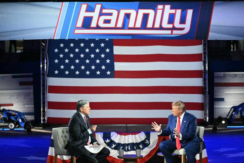 Former President Donald Trump, the Republican presidential nominee, takes part in an interview conducted by Fox News host Sean Hannity at the New Holland Arena in Harrisburg, Pa., on Thursday.