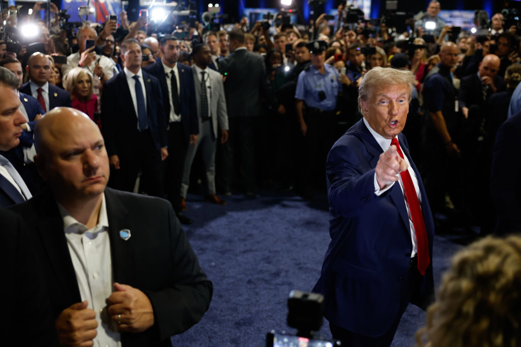 Former President Donald Trump speaks to reporters in the spin room after debating Vice President Kamala Harris in Philadelphia on Tuesday night.