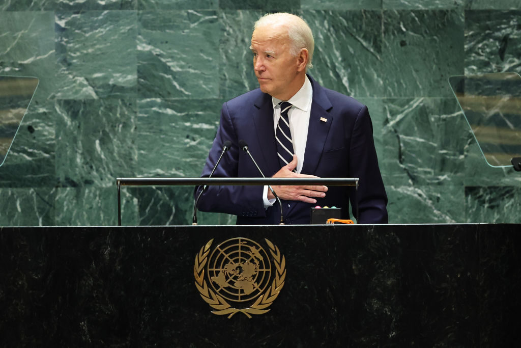 President Joe Biden places his hand on his chest as he leaves the stage after delivering his final address as president to the United Nations General Assembly in New York. (Michael M. Santiago/Getty Images)