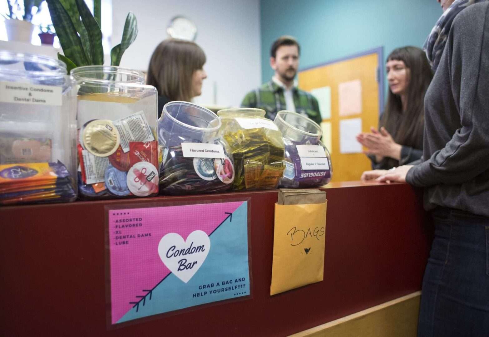 Staff members hold an informal meeting before opening a free STD clinic in Portland, Maine. The CDC has told states it’s reducing funding for workers who fight sexually transmitted infections by $400 million.