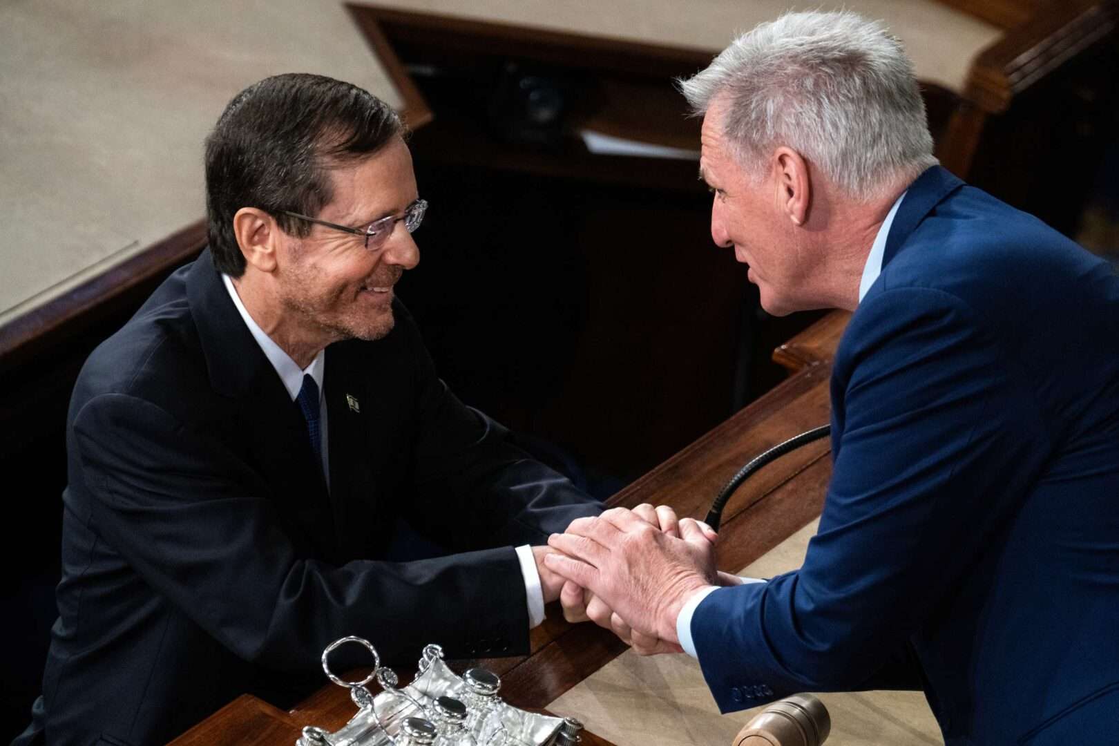 Israeli President Isaac Herzog, left, greets Speaker Kevin McCarthy, R-Calif., after Herzog addressed a joint meeting of Congress Wednesday. 