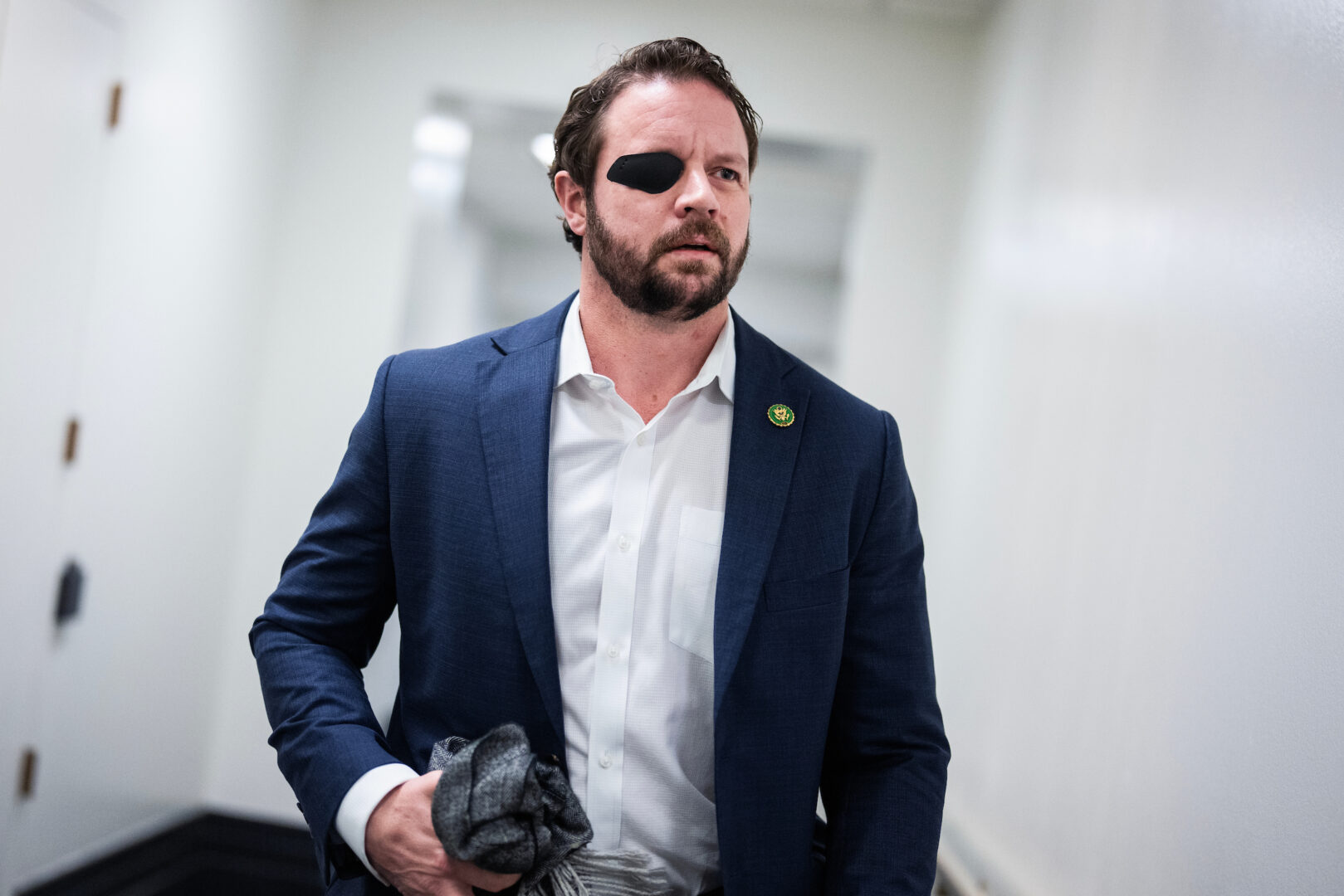 Rep. Dan Crenshaw, R-Texas, in the Capitol in February. He says  "Congress should act" regarding incidents involving United Airlines flights.