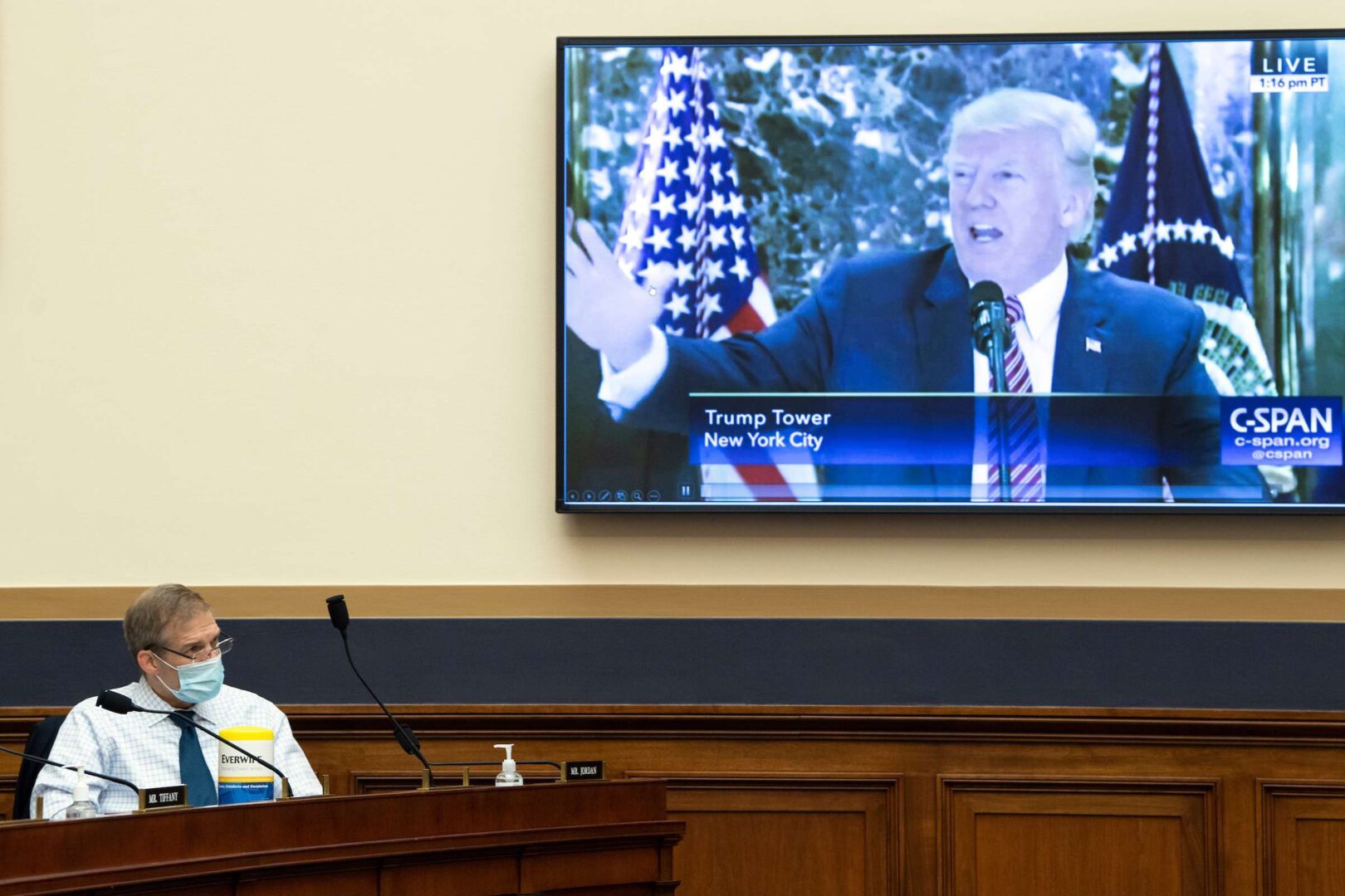 Ohio Rep. Jim Jordan, watches a video of former President Donald Trump play during a House Judiciary Subcommittee hearing in February on domestic terrorism.