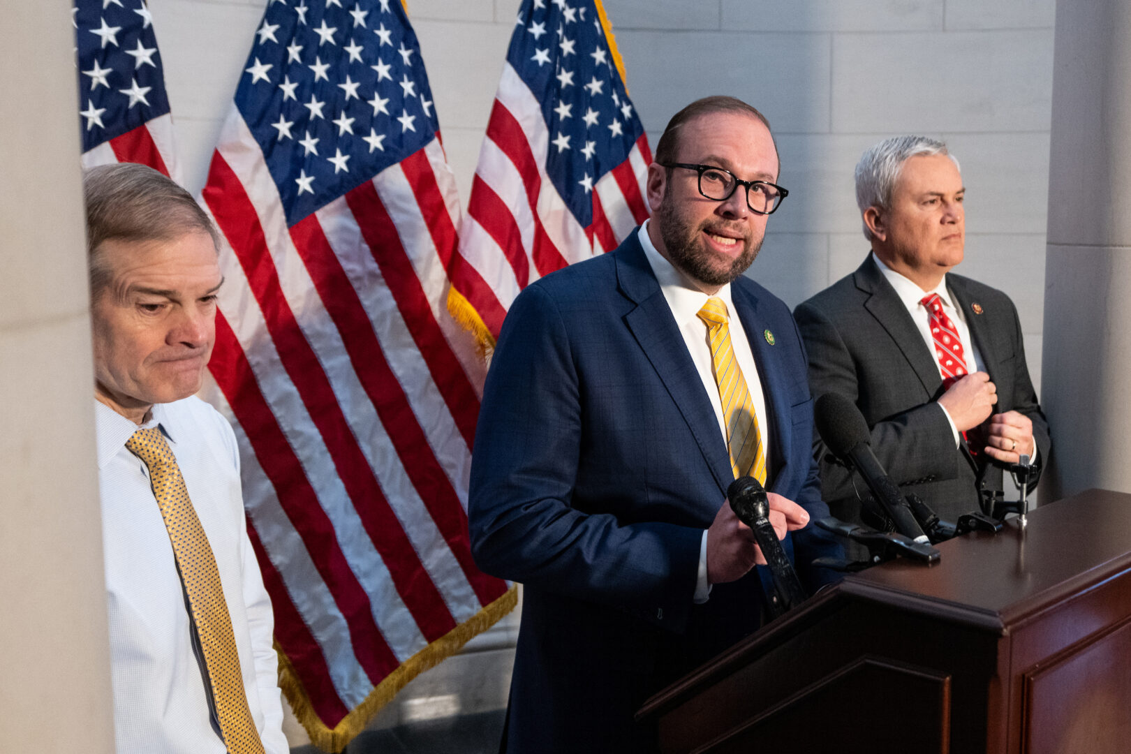 House Ways and Means chairman Jason Smith, center, faces blowback on his bipartisan tax package.