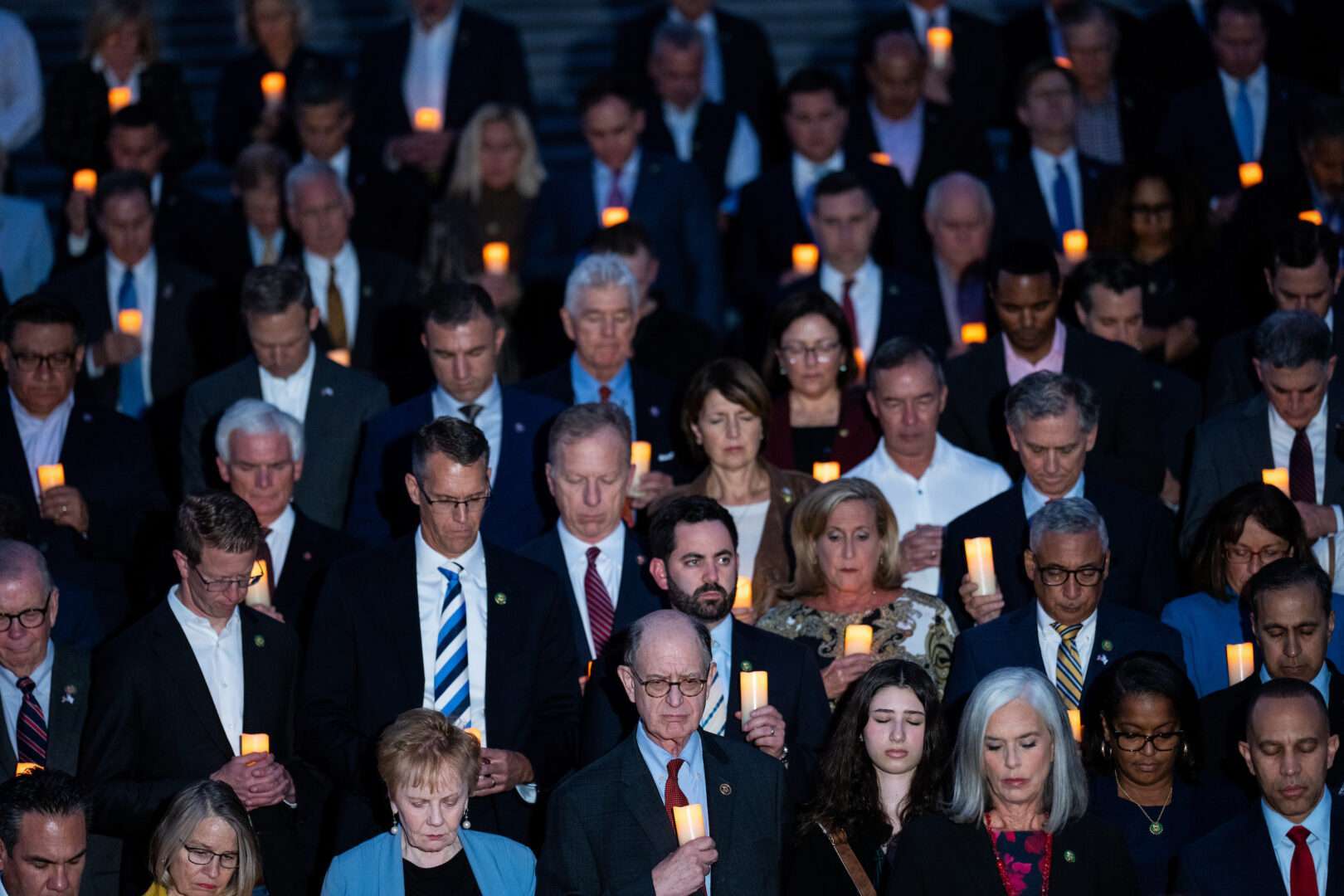 House members take part in a vigil on the Capitol’s steps on Thursday to commemorate the more than 1,000 lives lost in Israel. 