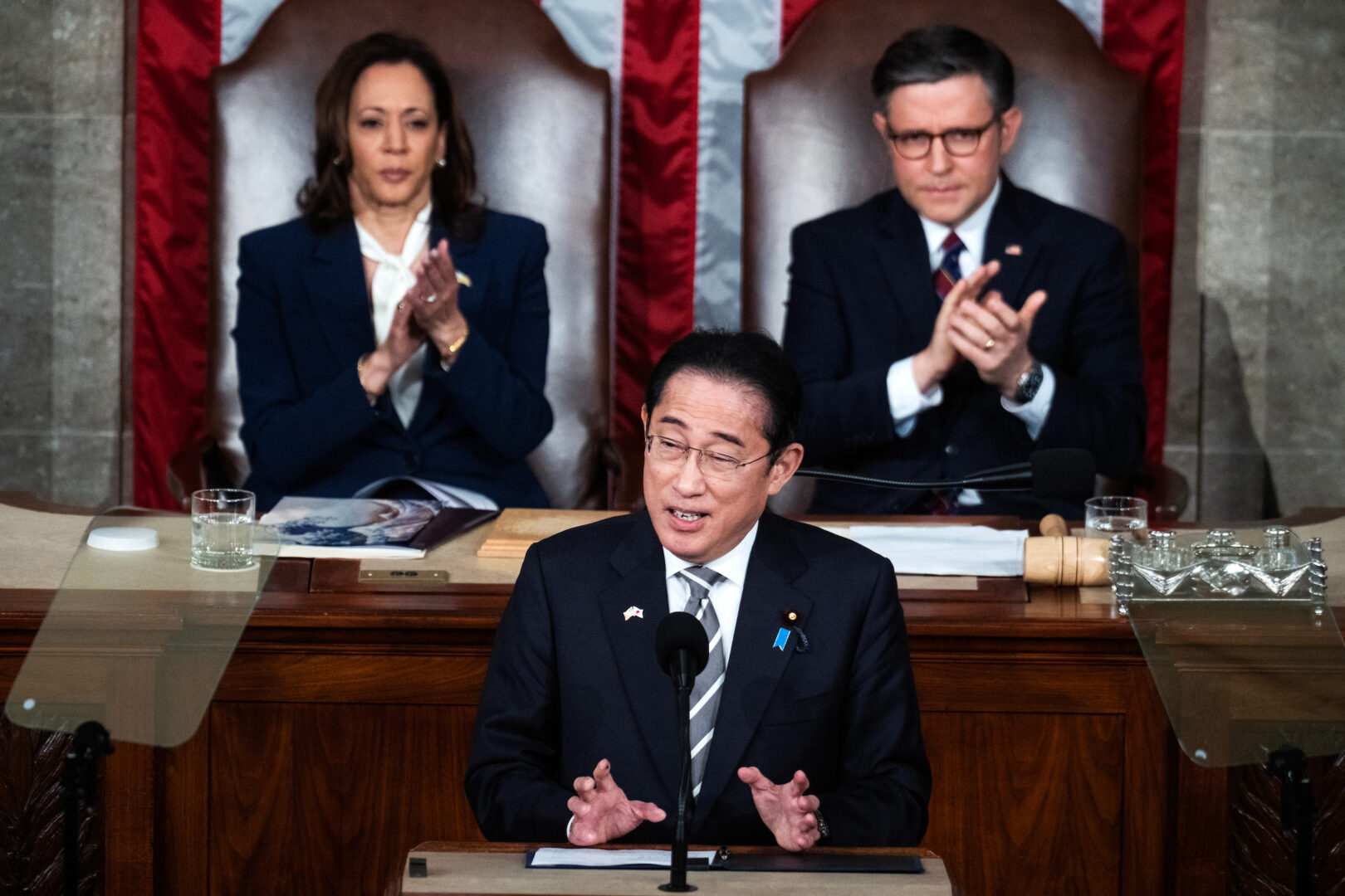 Japanese Prime Minister Fumio Kishida addresses a joint meeting of Congress as Speaker Mike Johnson and Vice President Kamala Harris look on.