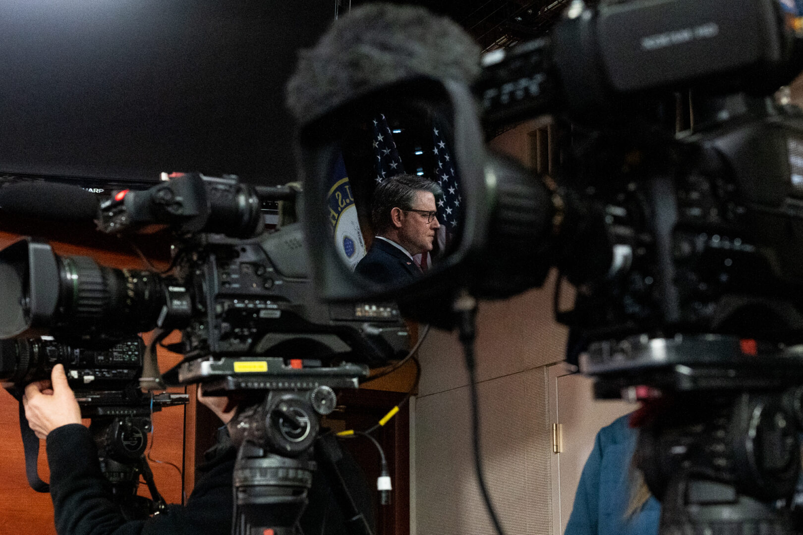 Speaker Mike Johnson, R-La., reflected in a video camera lens, participates in a news conference after the House Republican Conference meeting in the Capitol on Thursday.