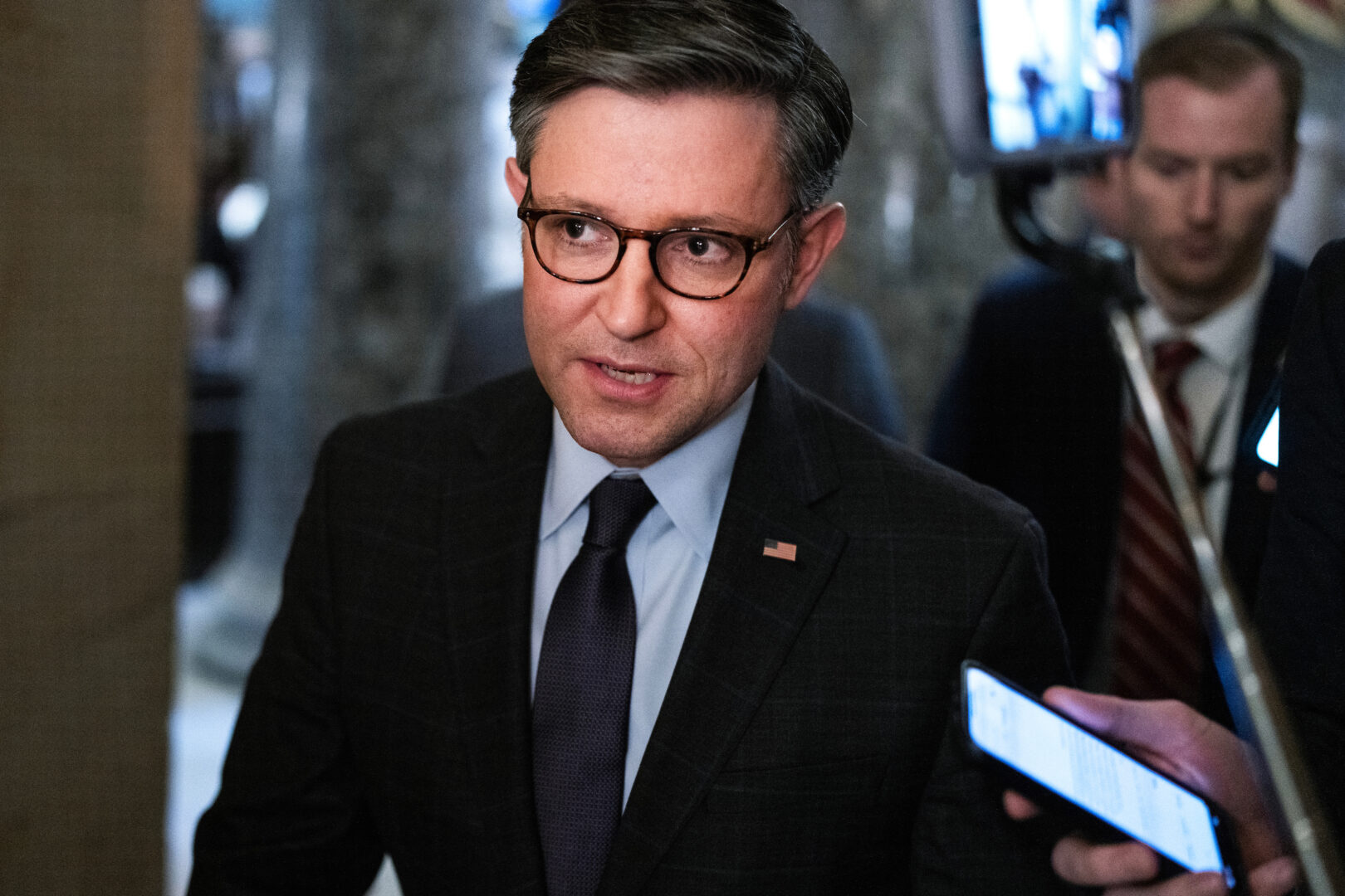 Speaker Mike Johnson, R-La., speaks to reporters in the Capitol on Dec. 6, 2023.