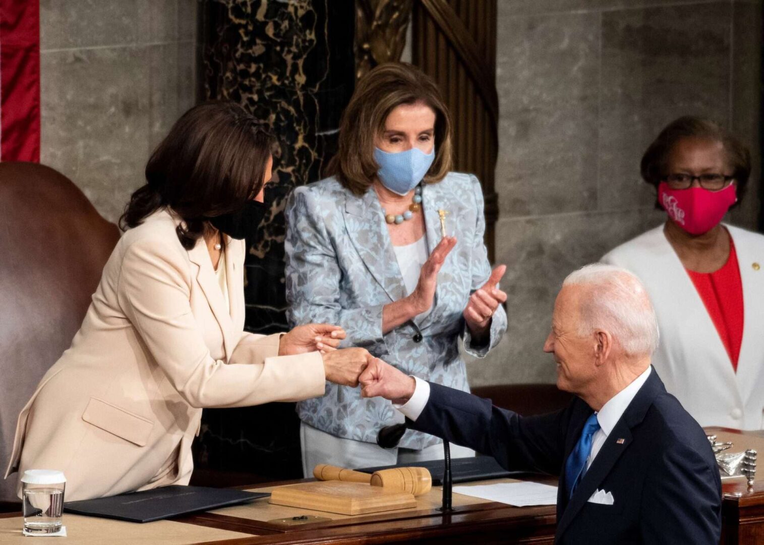 President Joe Biden fist-bumps Vice President Kamala Harris at his April 28 joint session address as Speaker Nancy Pelosi looks on. Voters may end up frowning on his expansive government agenda, Rothenberg writes. 