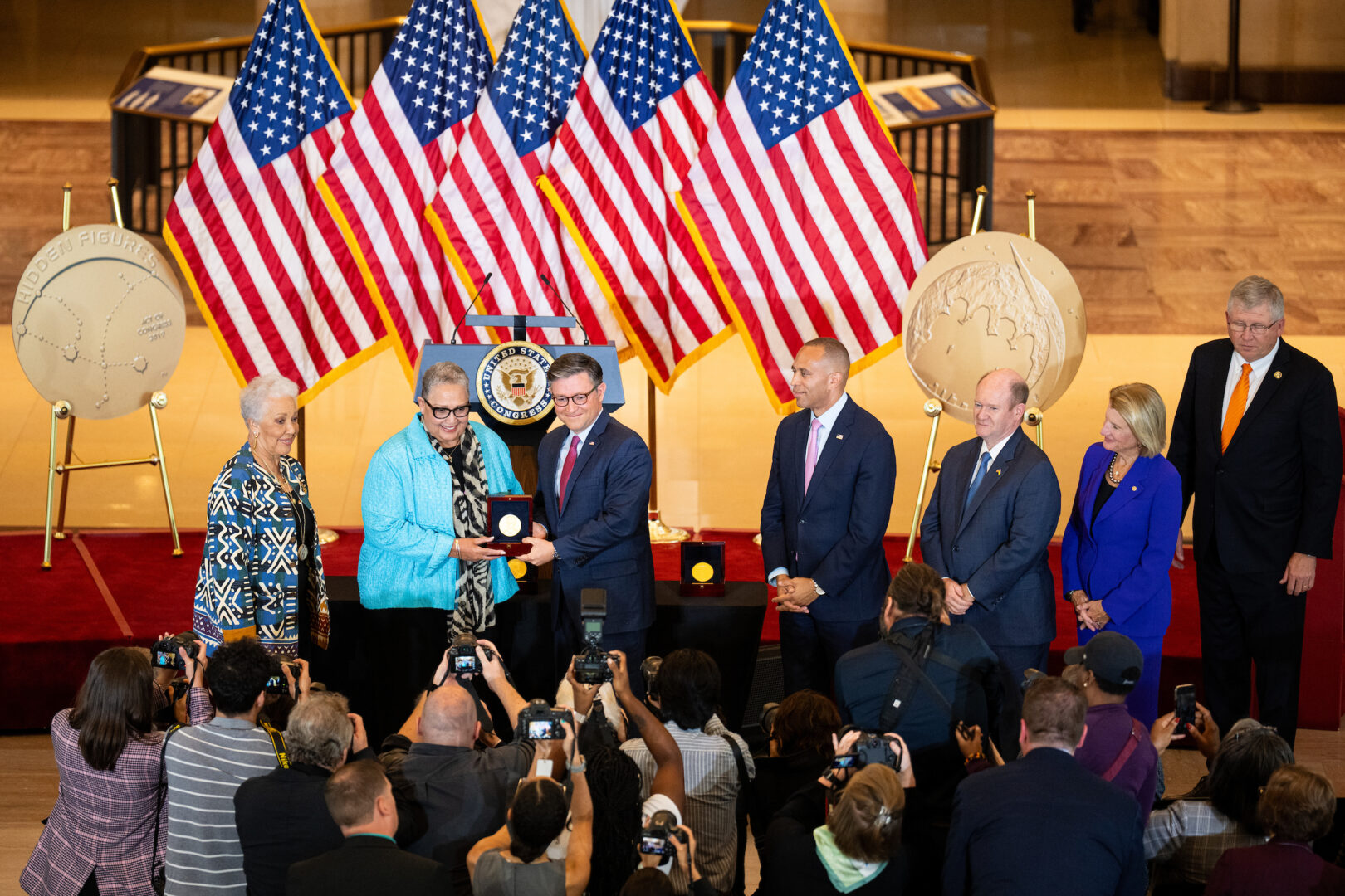 Joylette Hylick and Katherine Moore, daughters of Katherine Johnson, accept the "Hidden Figures'" Congressional Gold Medal from Speaker Mike Johnson on Wednesday. 