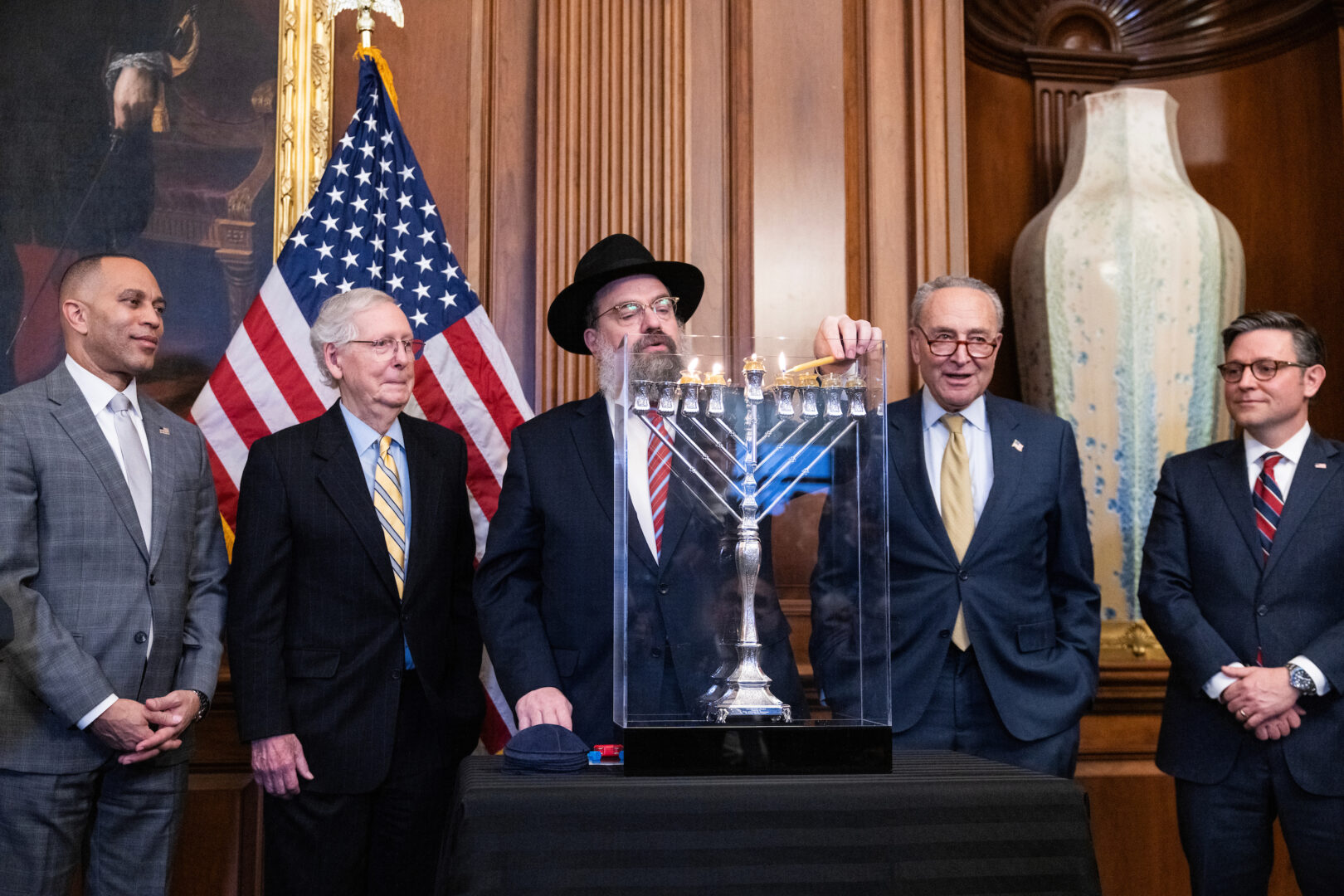 Rabbi Levi Shemtov, center, joins congressional leaders on Tuesday to light a menorah. 