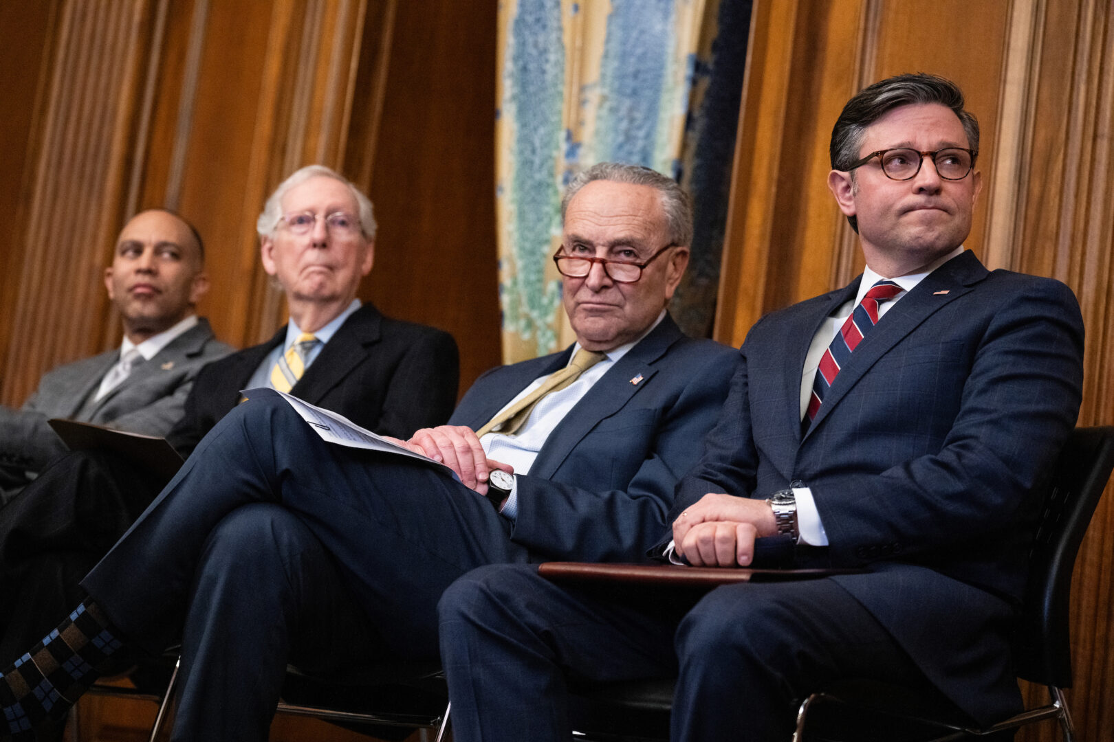 From left, House Minority Leader Hakeem Jeffries, D-N.Y., Senate Minority Leader Mitch McConnell, R-Ky., Senate Majority Leader Charles E. Schumer, D-N.Y., and Speaker Mike Johnson, R-La., attend a menorah lighting to celebrate Hanukkah in the Capitol on Dec. 12, 2023. 