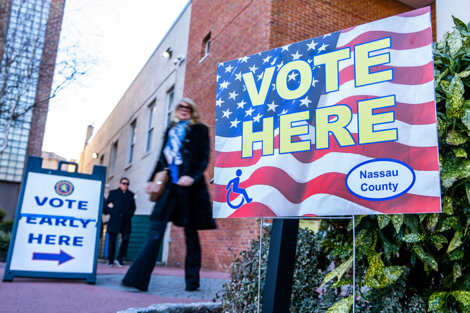 Voting signs are seen outside a polling place in New York during a special election this February. As the presidential campaign season heats up, election administrators around the country are calling for more security grant funding. 