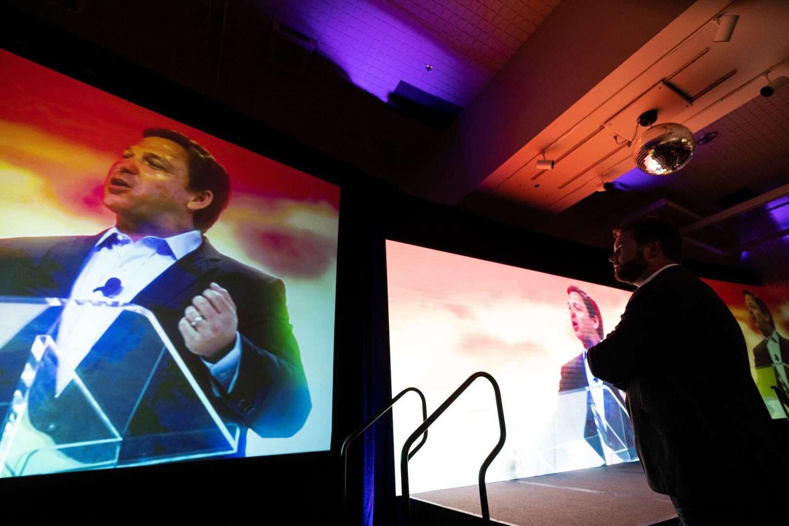 Florida Gov. Ron DeSantis, seen last year on a video screen at a Turning Point Action rally in Youngstown, Ohio, is widely expected to seek the GOP presidential nomination. 