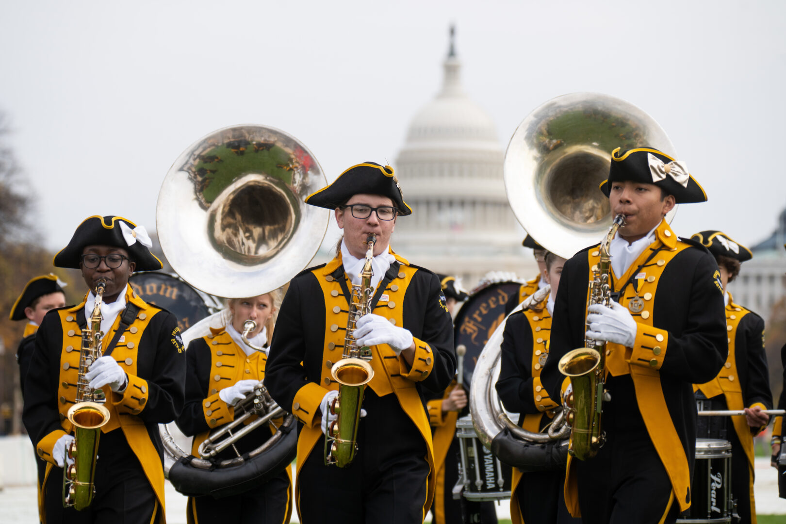 The Freedom High School Patriot Band from Bethlehem, Pa., warms up on the National Mall before the start of the first National Veterans Parade in Washington on Sunday.