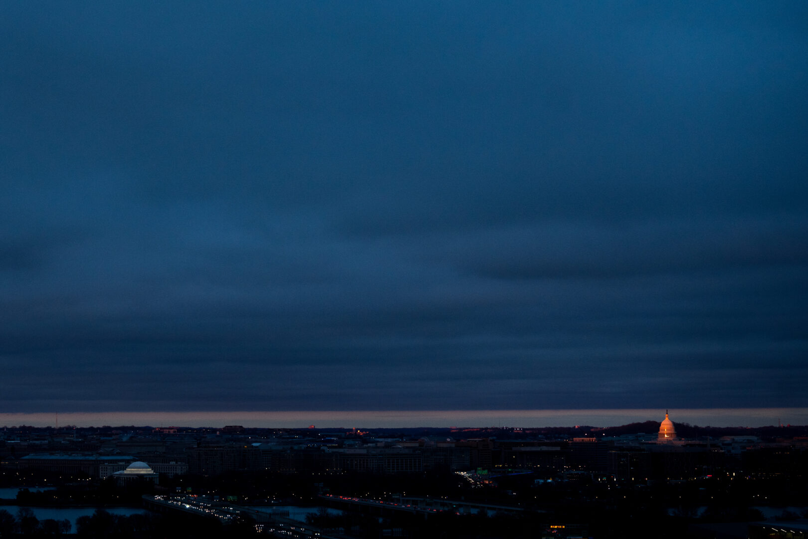 Sunset light illuminates the Capitol dome in Washington on Saturday evening. 