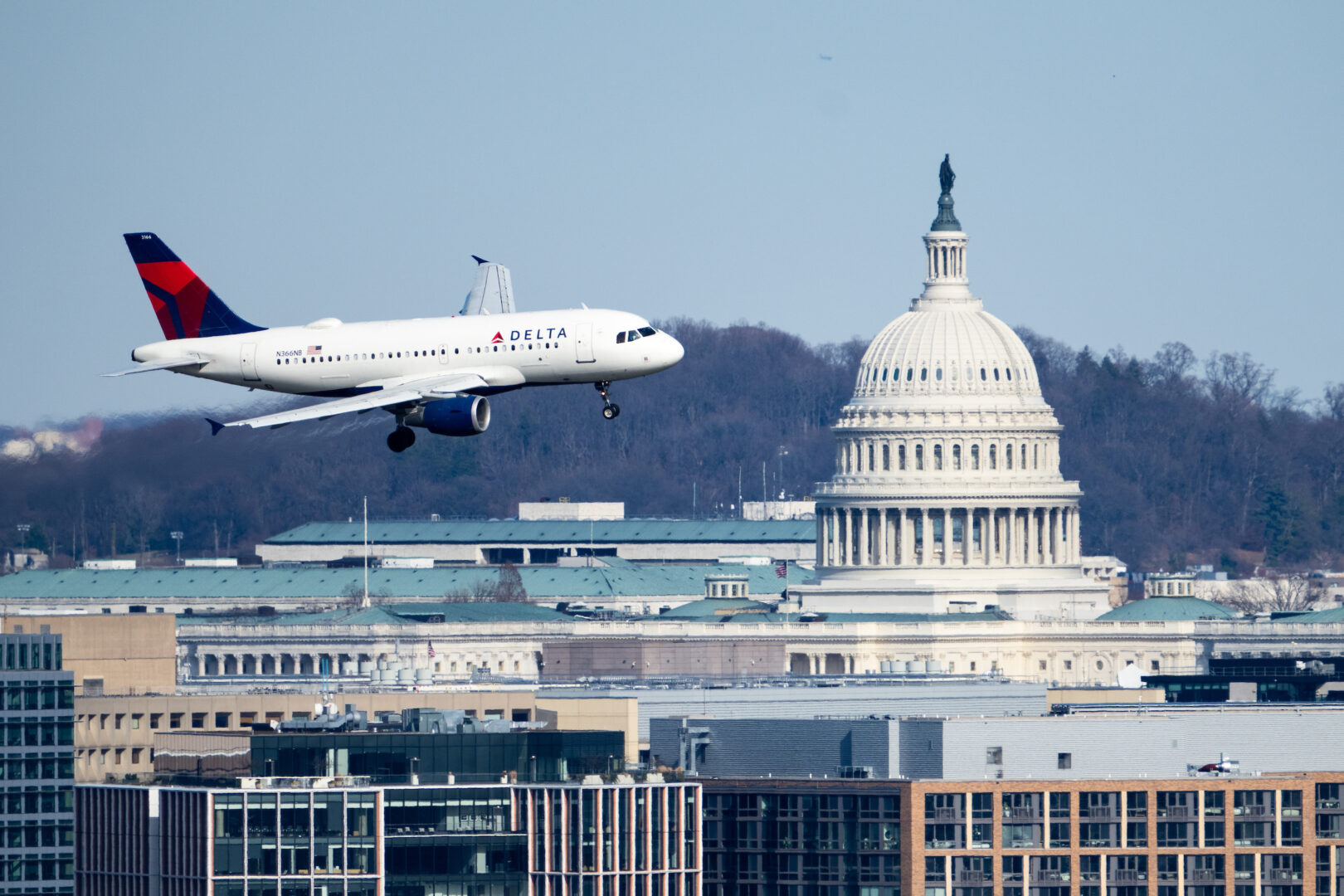 A Delta Air Lines jet flies past the Capitol dome as it approaches Ronald Reagan Washington National Airport on February 18. 